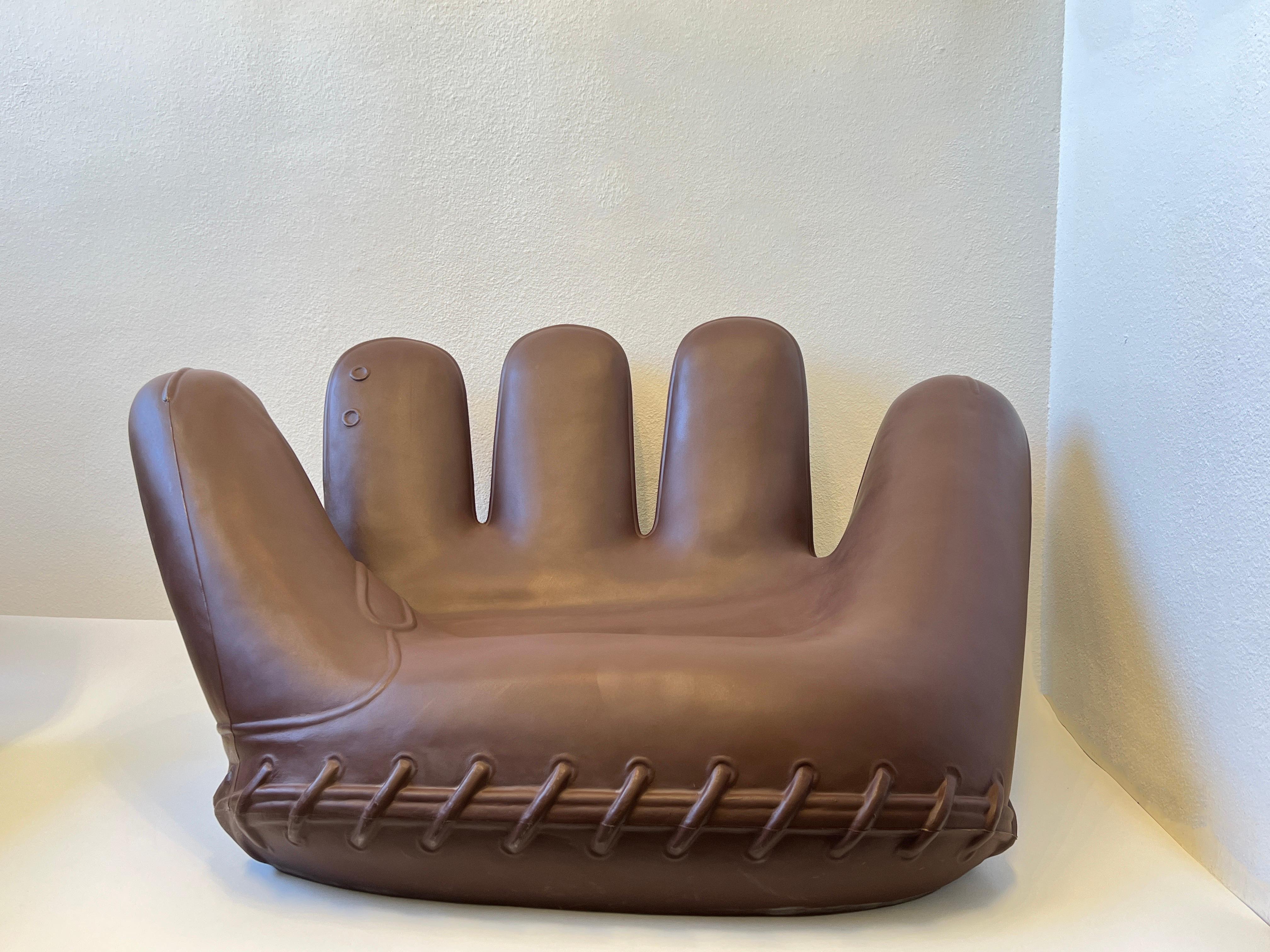 Cool Cast brown plastic Joe Glove chair designed by Gionathan de Pas, Donato D’Urbino and Paolo Lomazzi in 2003 for Heller. Design for outdoor. 
Shows some wear consistent with age(see detail photos). 

Measurements: 64” Wide, 42” Deep, 33” High,