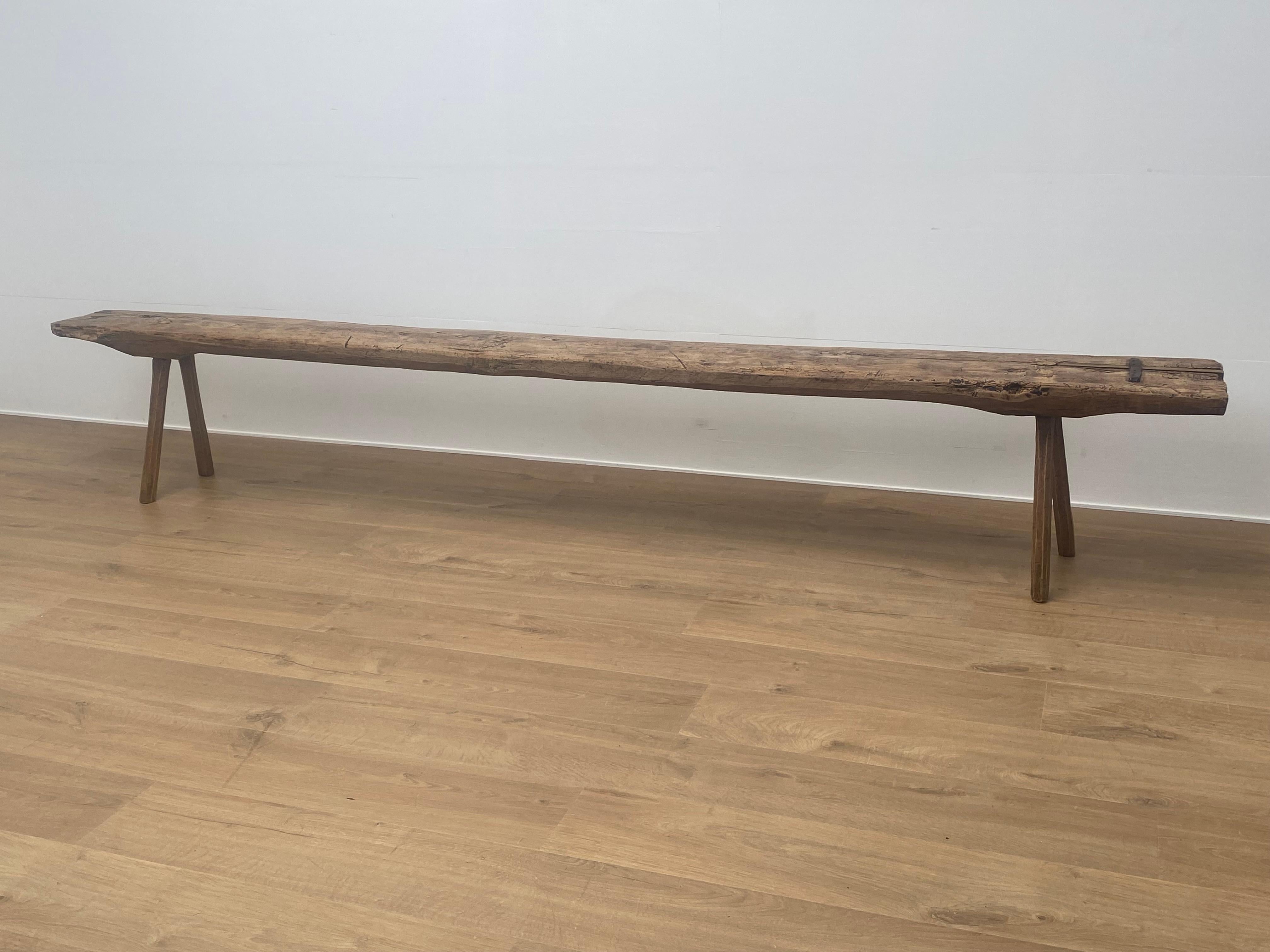 Brutalist and antique Italian Bench in a bleached Fruitwood,
elegant feet and nice weathered top,
there is also an old metal restoration ,
very powerful bench with a beautiful old patina