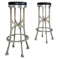 Italian brutalist style high stools in aluminum and black leather, 1940s