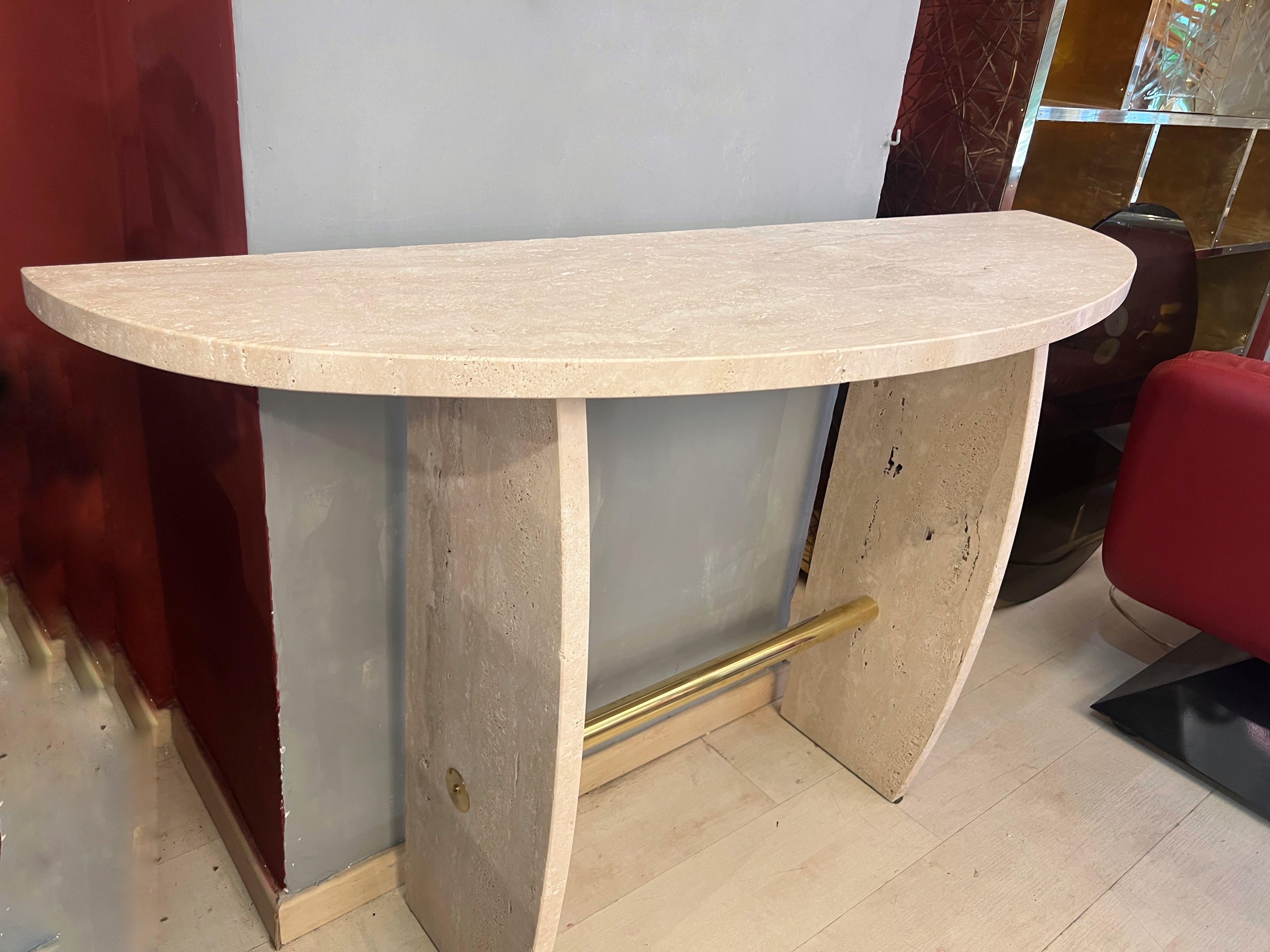 Italian Brutalist Travertine Marble Console Table.
The Console is more like a piece of sculpture with finest Italian travertine marble in perfect proportion.
The Brutalist Travertine presents its natural imperfections because is a rough and