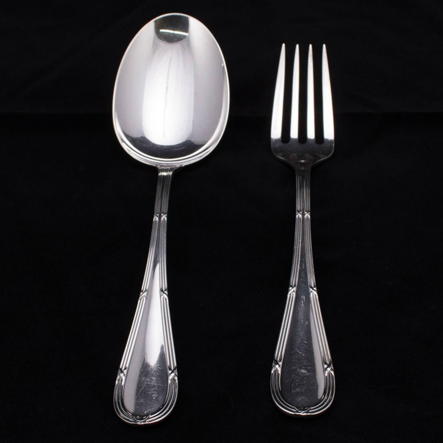 Italian Buccellati sterling silver spoon and fork serving set, en verso maker and sterling marks, 9.68 toz, circa 1930.

Measure: 11