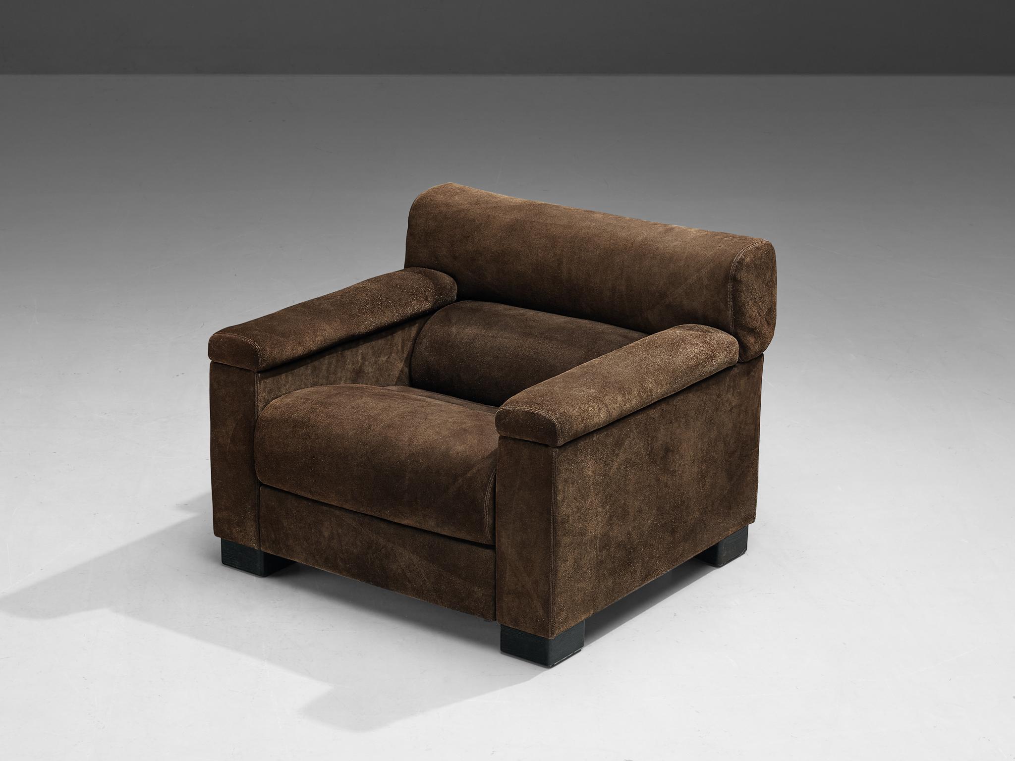 Tecno, lounge chair, suede, dark stained wood, Italy, 1960s. 

A substantial and sizable armchair produced by Italian furniture company Tecno. The bulky appearance is amplified by the upholstery, which features a dark brown suede upholstery. The