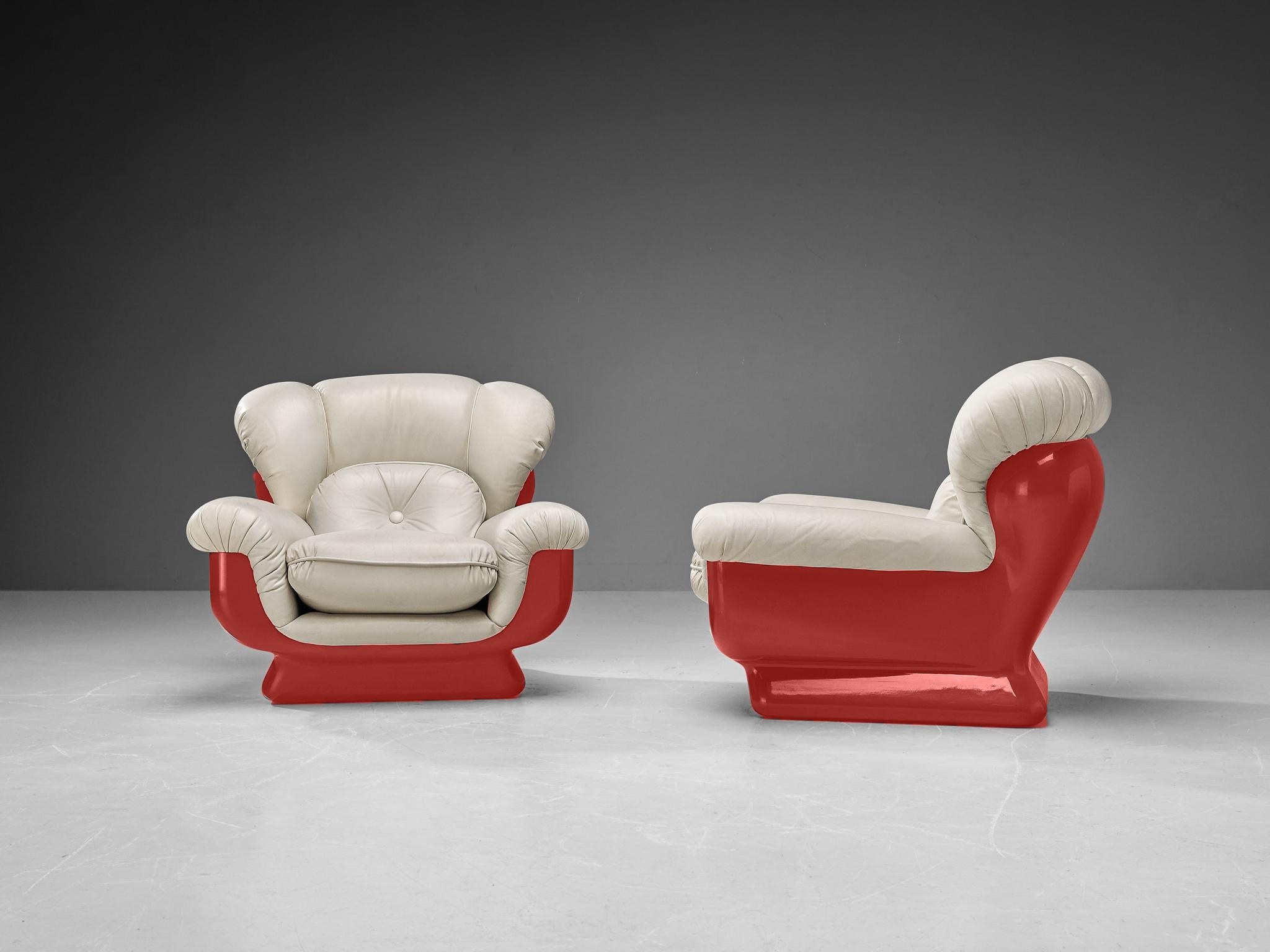 Pair of lounge chairs, fiberglass, faux leather, Italy, 1970s

A pair of very enjoyable bulky easy chairs in leatherette. These chairs are the ideal fit for anyone looking for comfort. The large cushioning makes the sitter feel like they are gliding