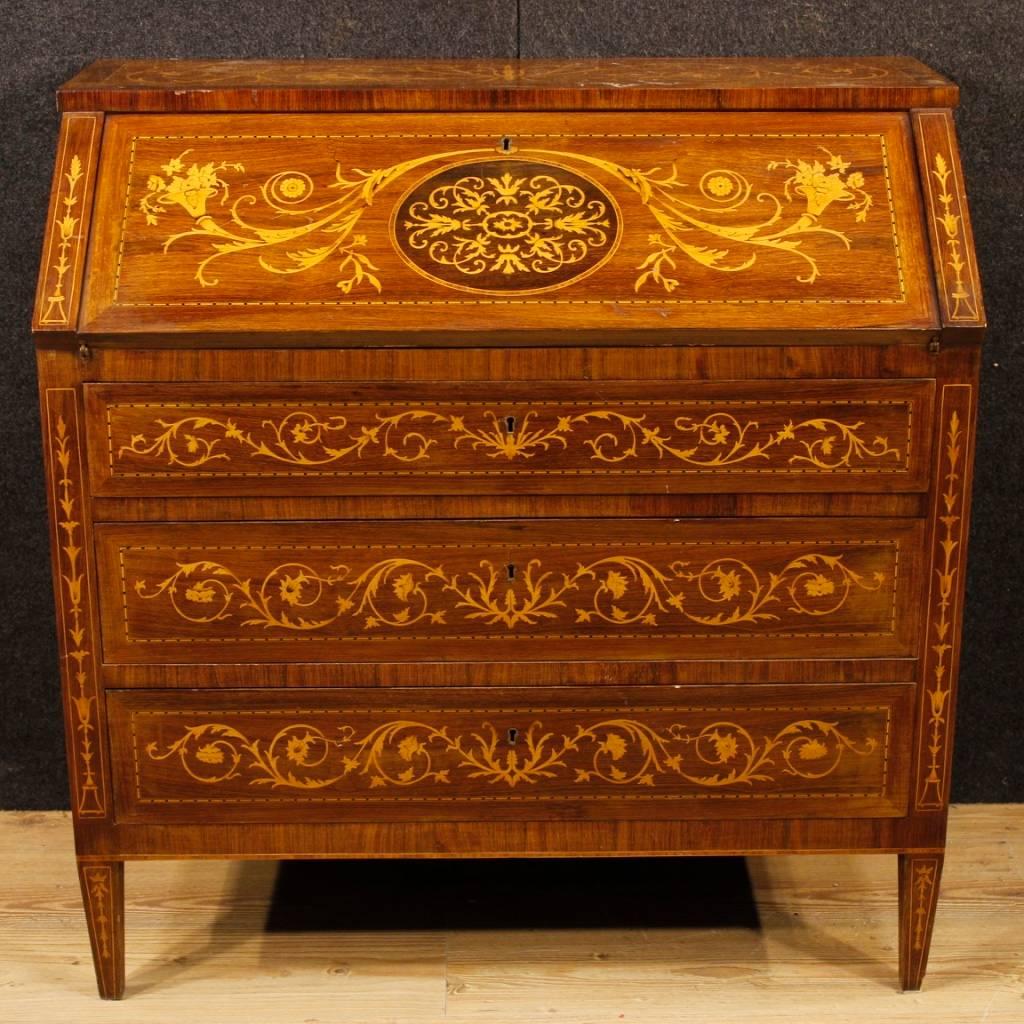 Italian bureau from 20th century. Louis XVI style furniture richly inlaid in walnut, rosewood, maple, palisander and fruitwood. Bureau equipped with three external drawers and fall-front. Interior of the fall-front, which is also richly inlaid,