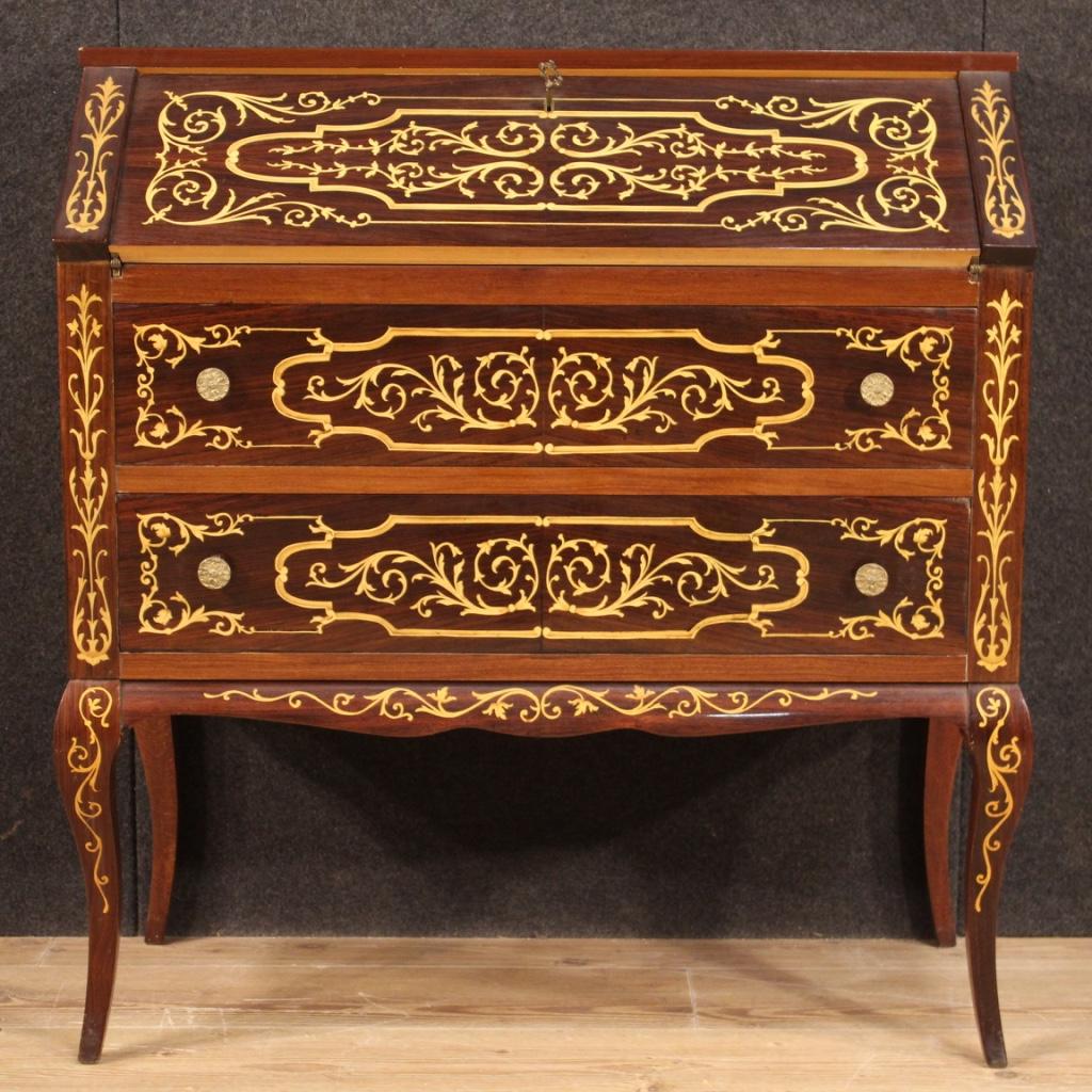 A stunning Italian bureau inlaid in palisander, maple, mahogany, fruitwood, 20th century.

Italian bureau from 20th century. Furniture richly inlaid in palisander, maple, mahogany and fruitwood of great impact. Bureau equipped with two external