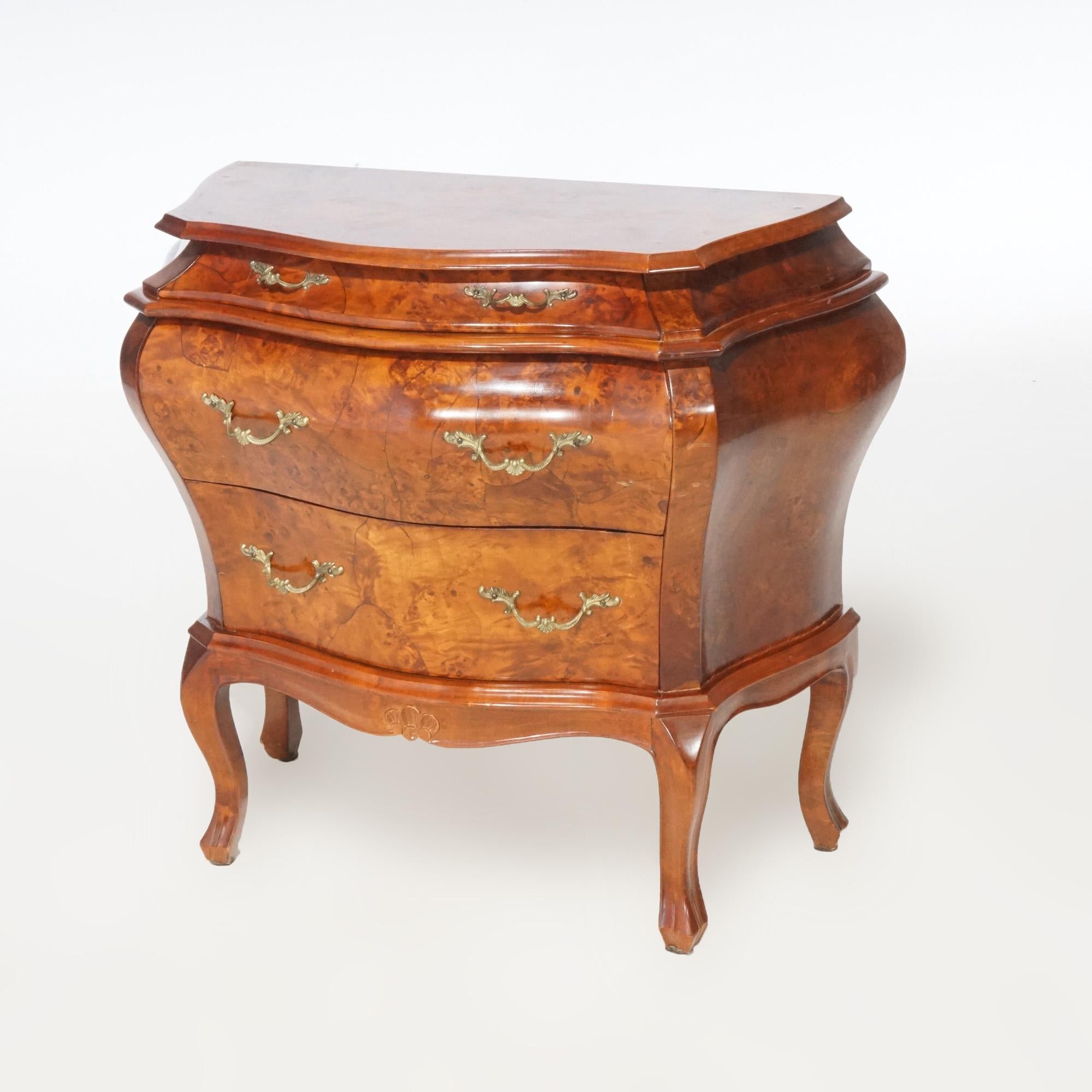 An Italian side stand by Bombay offers burl construction with three drawers and raised on cabriole legs, maker label en verso as photographed, 20th century.

Measures - 26