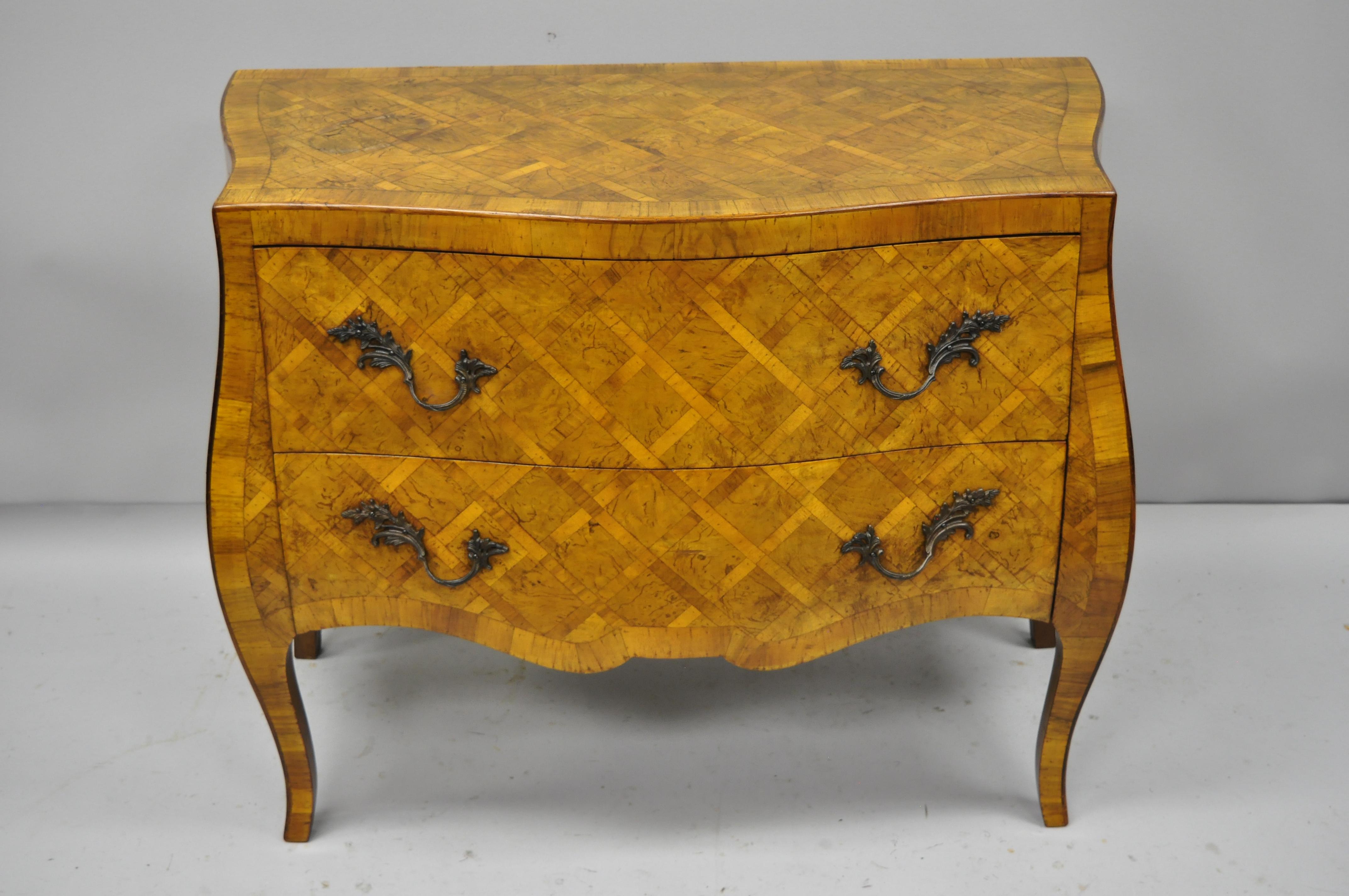 Italian burl olive wood parquetry inlaid French style bombe commode chest. Item features beautiful parquetry inlaid burl olive wood, shapely bombe form, original label, cabriole legs, great style and form, circa early to mid-20th century.