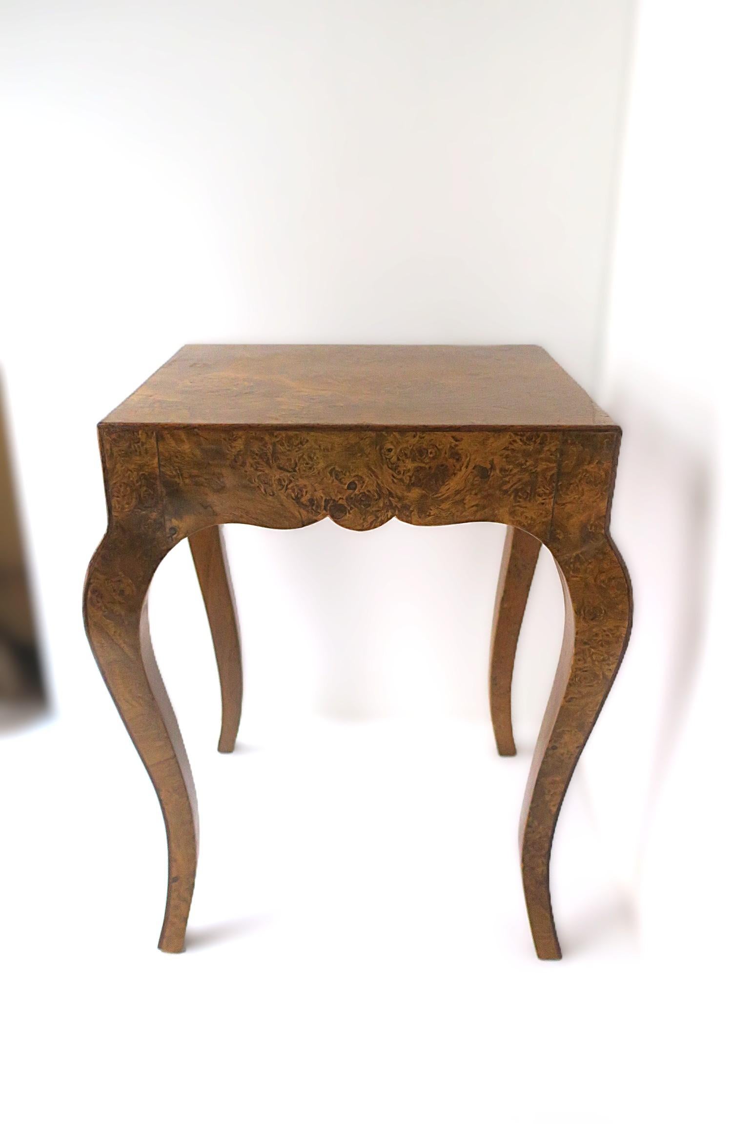 A beautiful, small, Italian burl side, end, or drinks table by Mecchi Ruggero, in the Rococo design style, circa mid-20th Century, Italy. Table has scalloped apron front (both sides) and cabriole legs. A convenient size as a small end table (shown