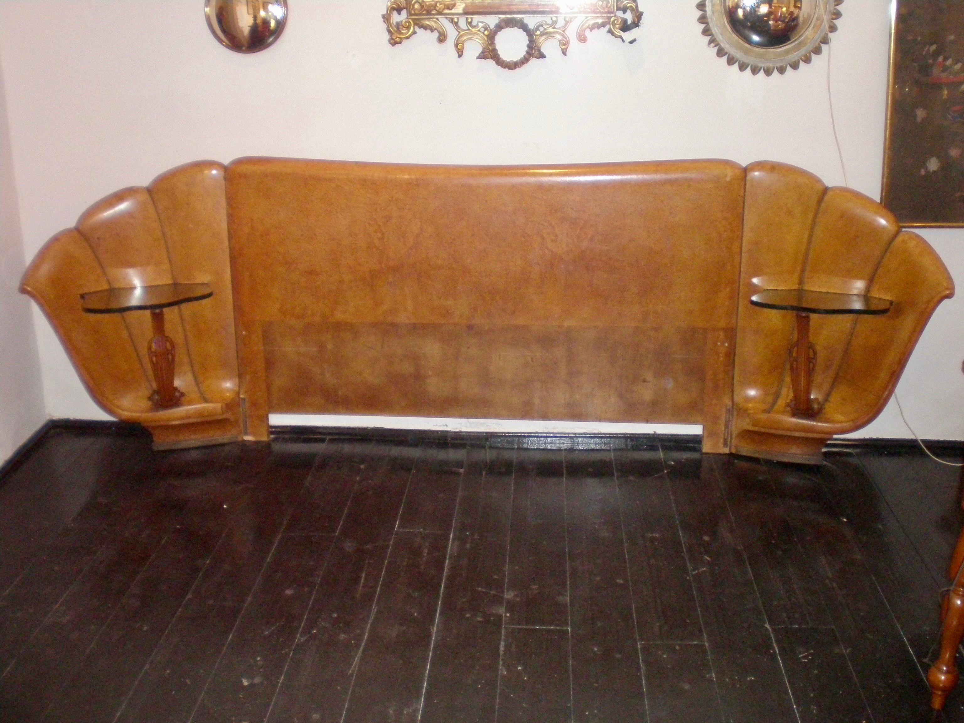 Italian burled walnut Art Deco headboard with attached shell shaped nightstands with brass studded inlays. 
The nightstands have a scalloped crystal top.
The headboard consists of three wood pieces that can be disassembled.
Queen size bed frame. The