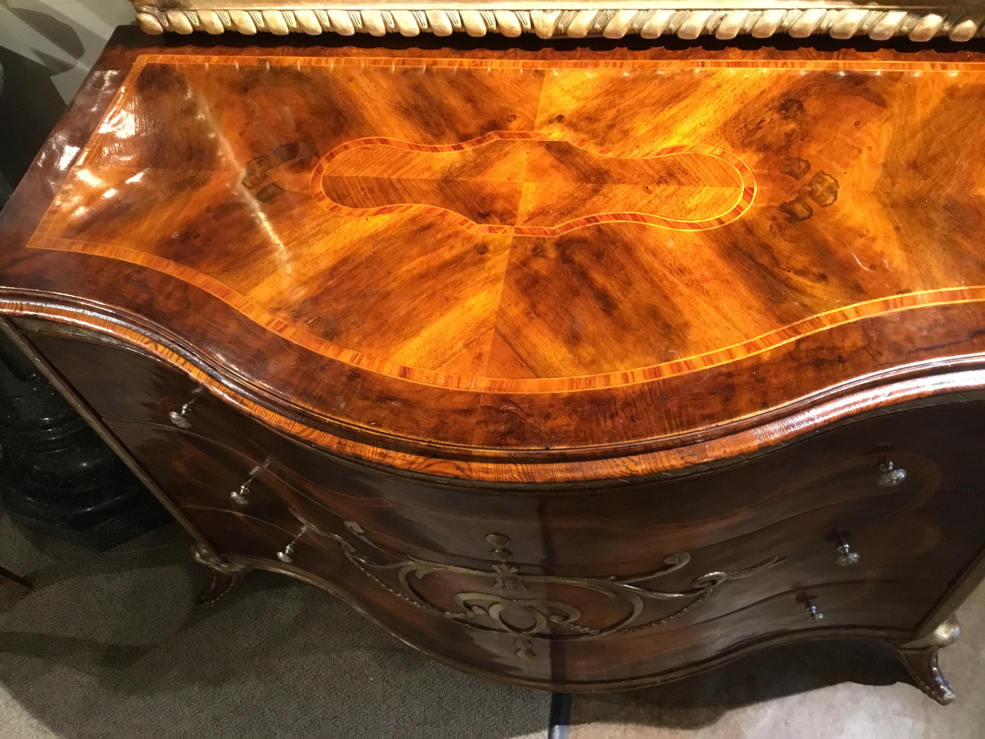 Very fine Italian commode made in Italy of burl walnut silver
Gilt carved detail enhances this handsome piece. King
Wood Inlay enriches this exceptional piece.
  Splayed leg. Three drawers.