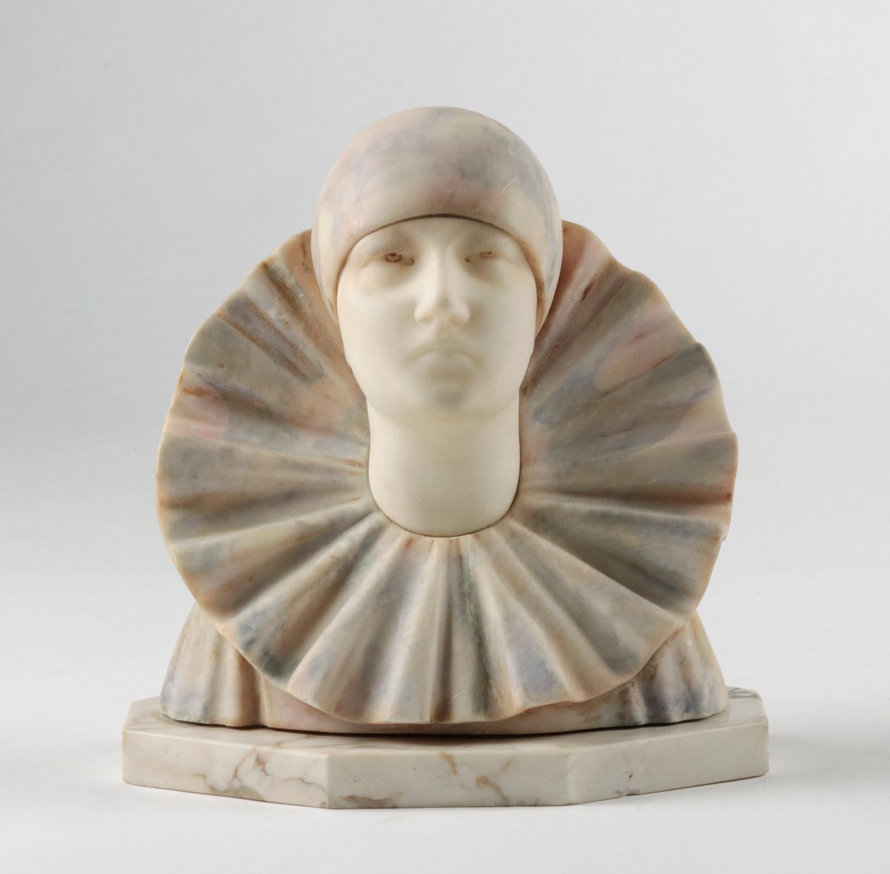 This beautiful statue was created by the Italian artist A. Gentili. It is an image of a clown or Pierrot. The face is made of beautiful white alabaster, which contrasts nicely with the colored alabaster of the clothes. The statue has a stylized,