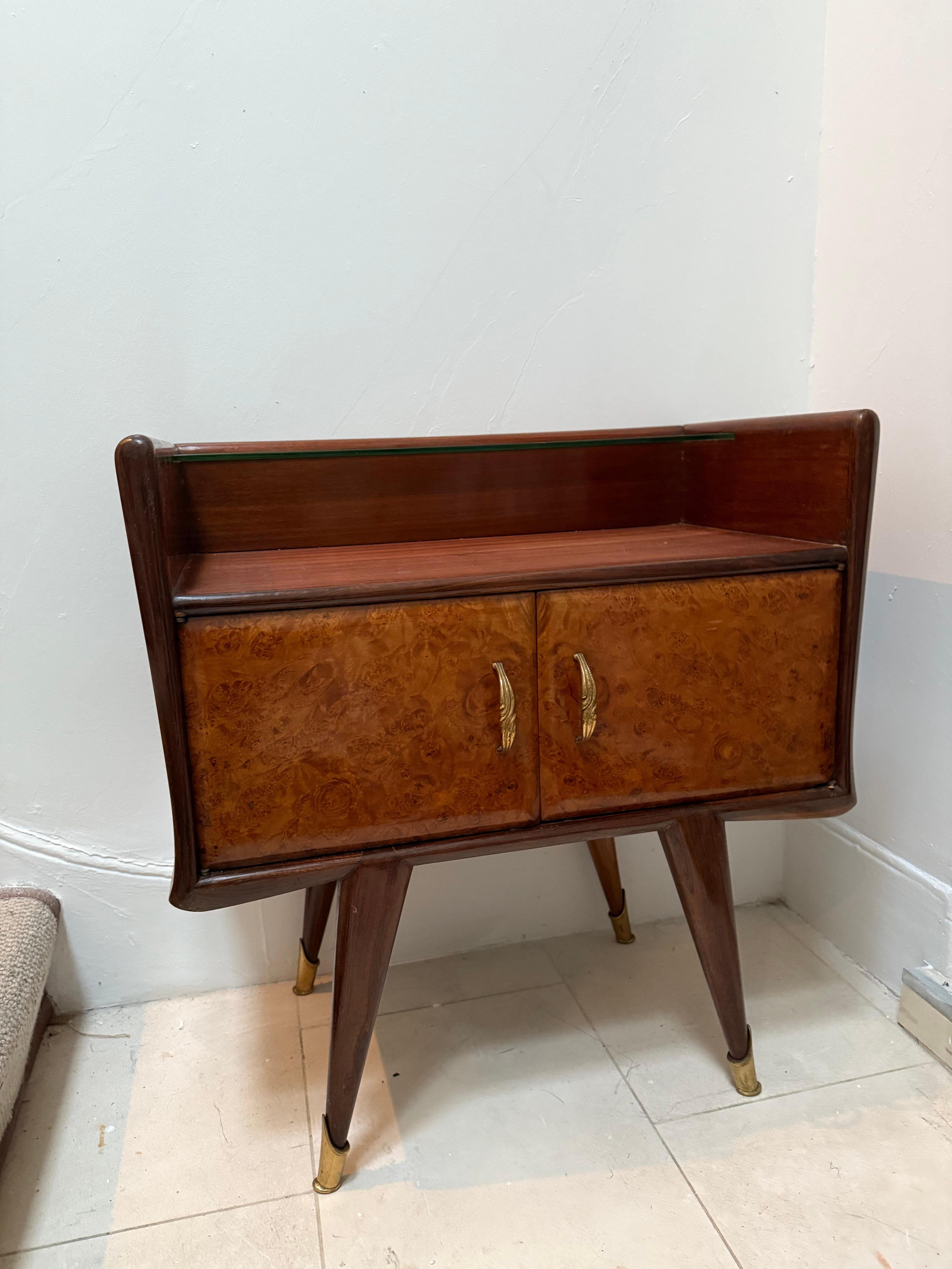 A pair of side tables by Vittorio Dassi Italian c.40's, French polish walnut and glass shelve on the top with a protected yellow glass on the bottom with a brass handles and brass feet sabots  