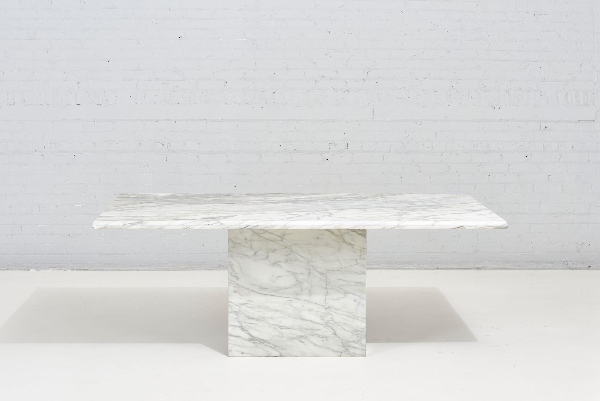 Italian Calacatta Statuario Marble Dining Table produced by Stone International, circa 1970. Beautiful white stone with grey, gold, & blue-grey colors throughout. Table is in excellent vintage condition.