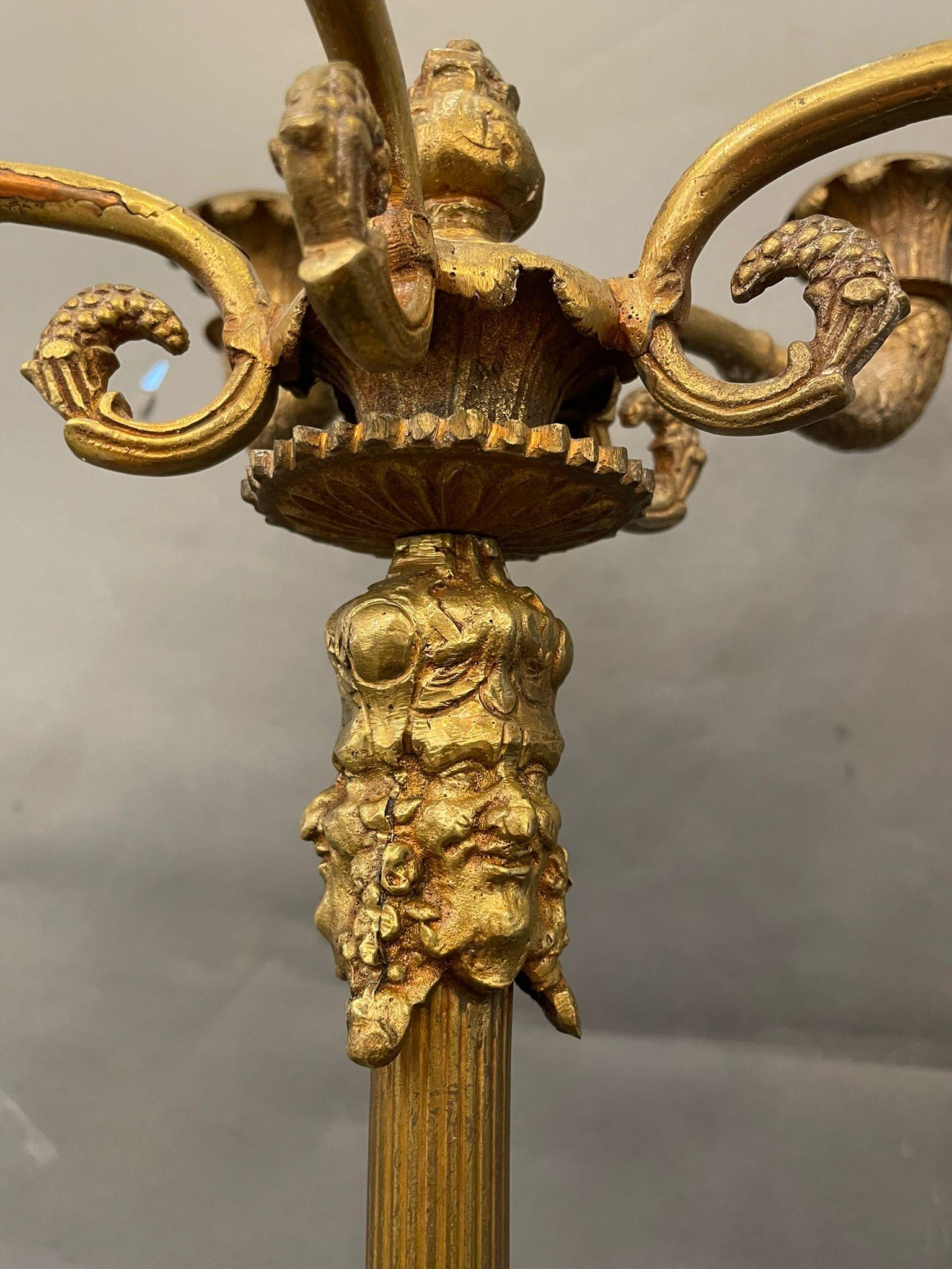 Pair of Italian Candelabras 1940s circa. Decorated with Bacchus' faces and grapes and vine leaves.