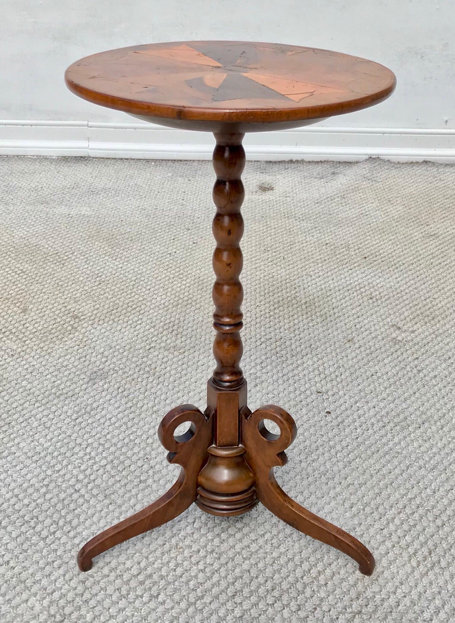 Late 19th century Italian candle stand having a gorgeous burl wood top that features a central fan inlay detail. Refinished in the late 20th century, the stand is strong and sturdy and ready for lots of everyday use in any fine interior.