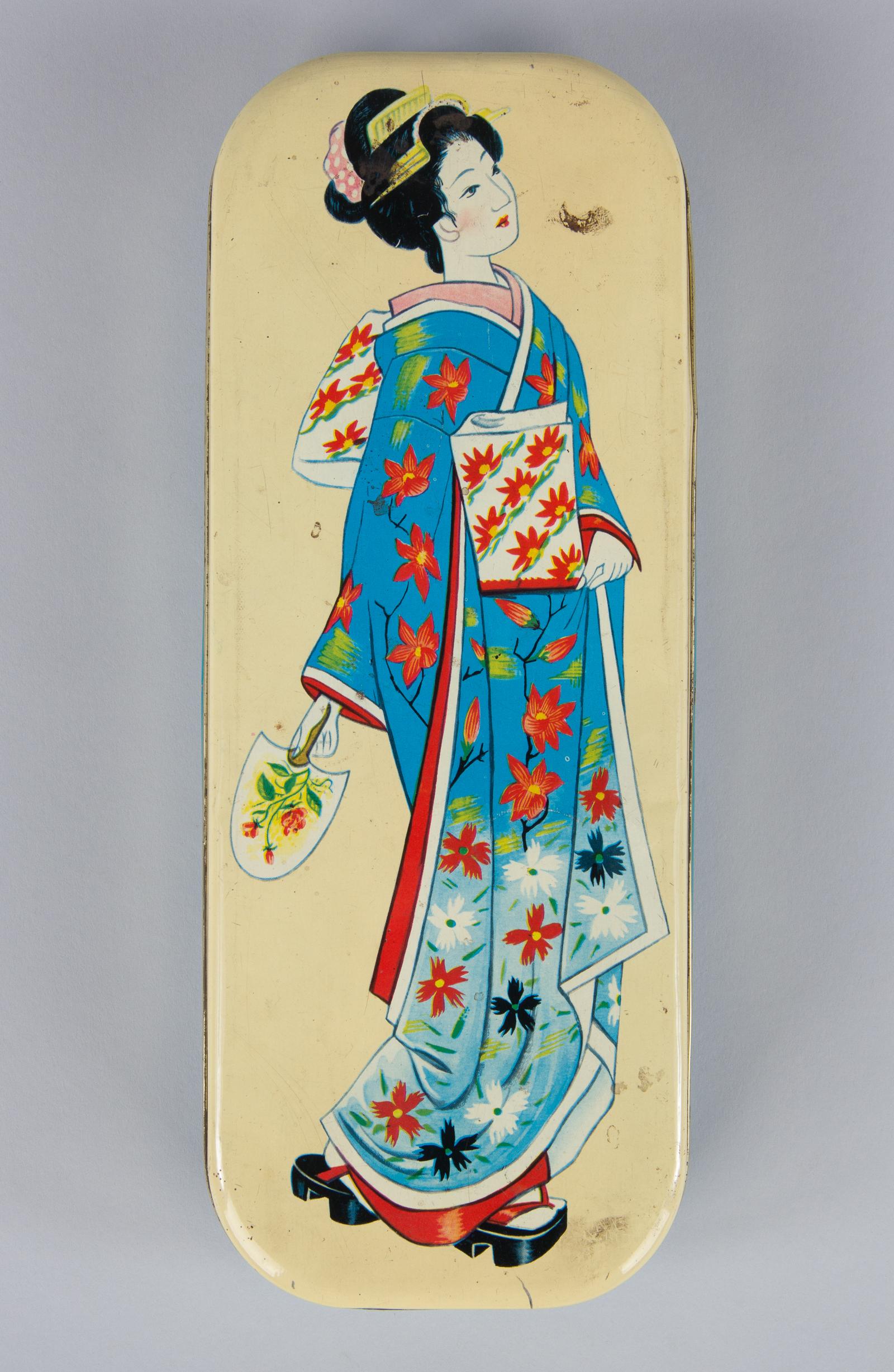 A colorful vintage Italian chocolate candy tin with geisha decoration, 20th century. The long, rectangular tin box is from the Motta company and held various flavors of chocolate bonbons. Full color decoration includes a beautiful depiction of a