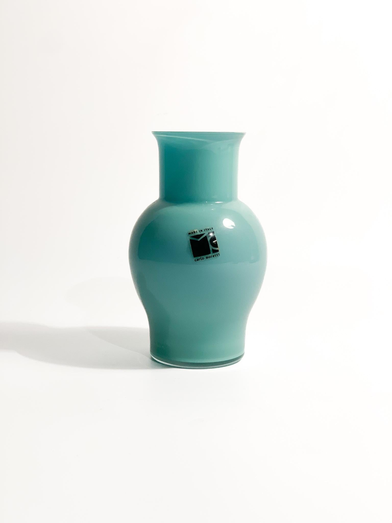 Opaline vase in light blue Murano glass, made by Caldo Moretti in the 1980s

Ø cm 8 h cm 13

Carlo Nason, born in Murano in 1935 from one of the oldest families of glassmakers on the island, he was a great master glassmaker. He grows up frequenting