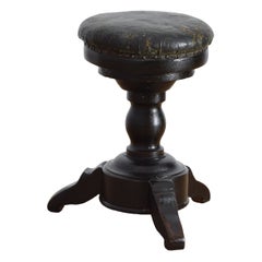 Taburete de piano ajustable italiano de la época de Carlos X, de nogal oscuro y cuero, de mediados del siglo XIX.