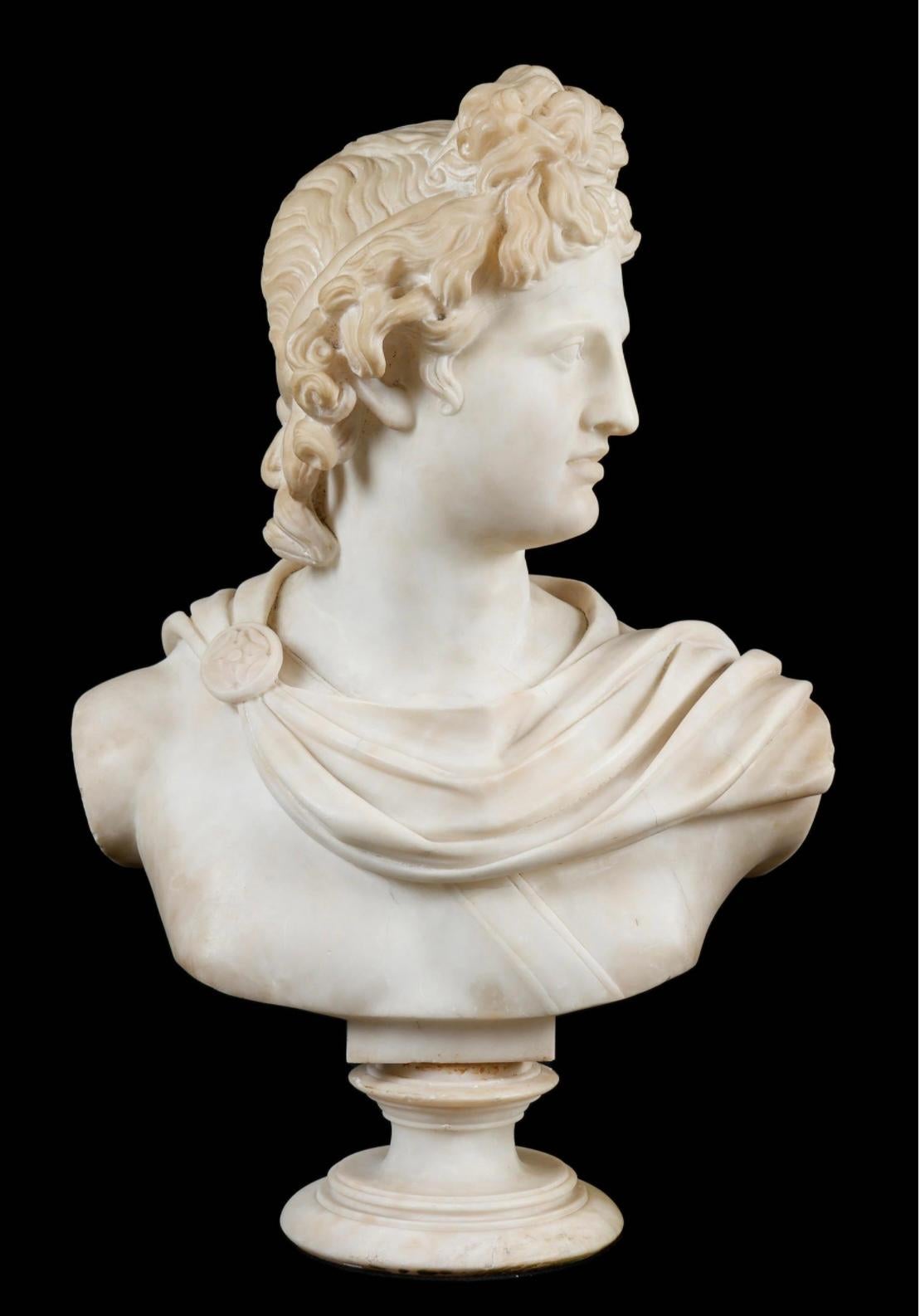 This impressive 19th century carrara marble bust is inspired by the famous marble sculpture found in the Vatican Museum. Apollo has been variously recognized as a God of music, poetry, art, medicine, sun, light and knowledge.
Here He is depicted in