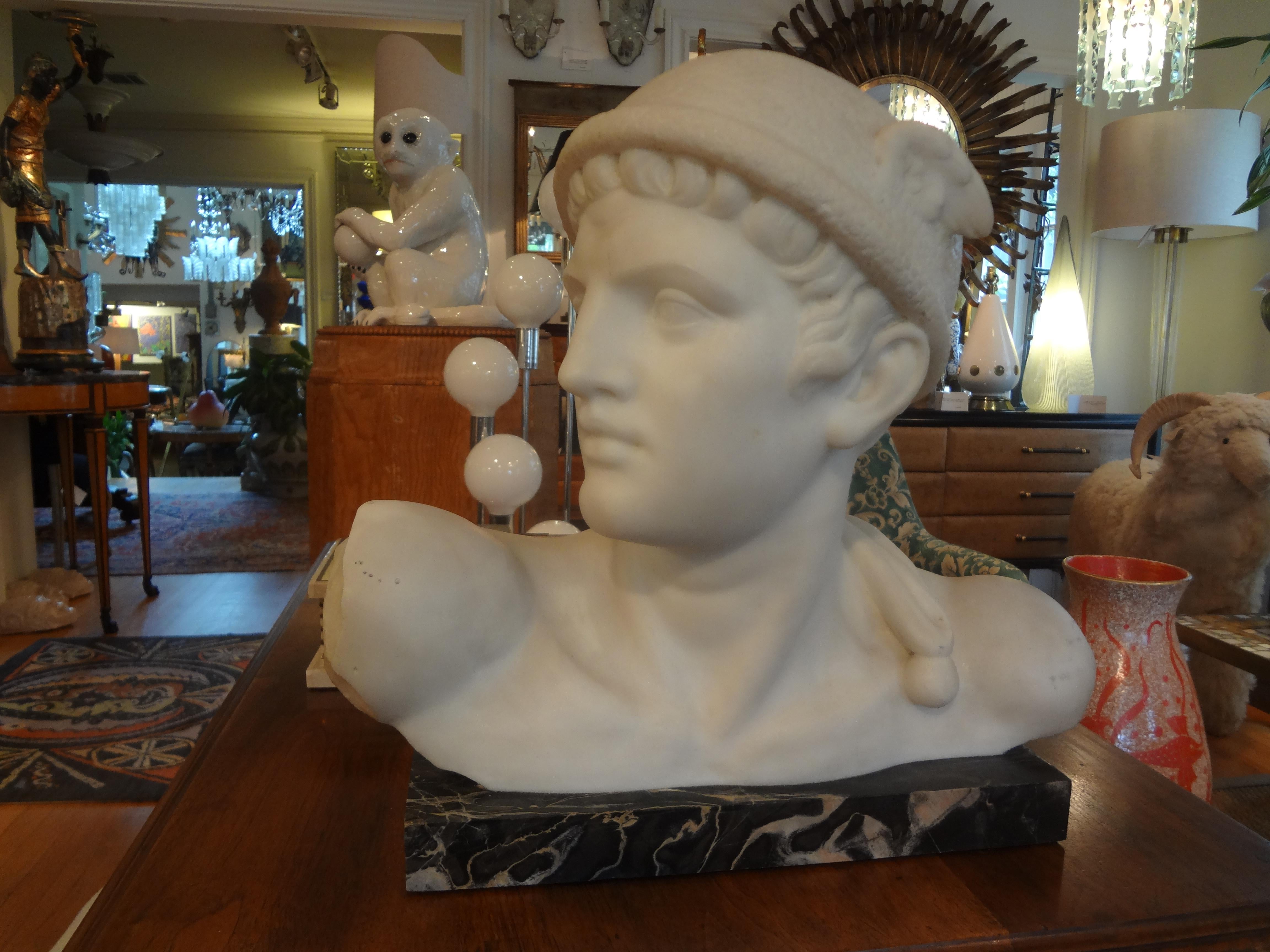 Outstanding Italian Carrara marble bust of Mercury or Hermes, signed Pugi, circa 1930. This carved marble sculpture from the studio of Guglielmo Pugi is a great example of the skill of the Pugi family. This Italian art deco bust is just one of many