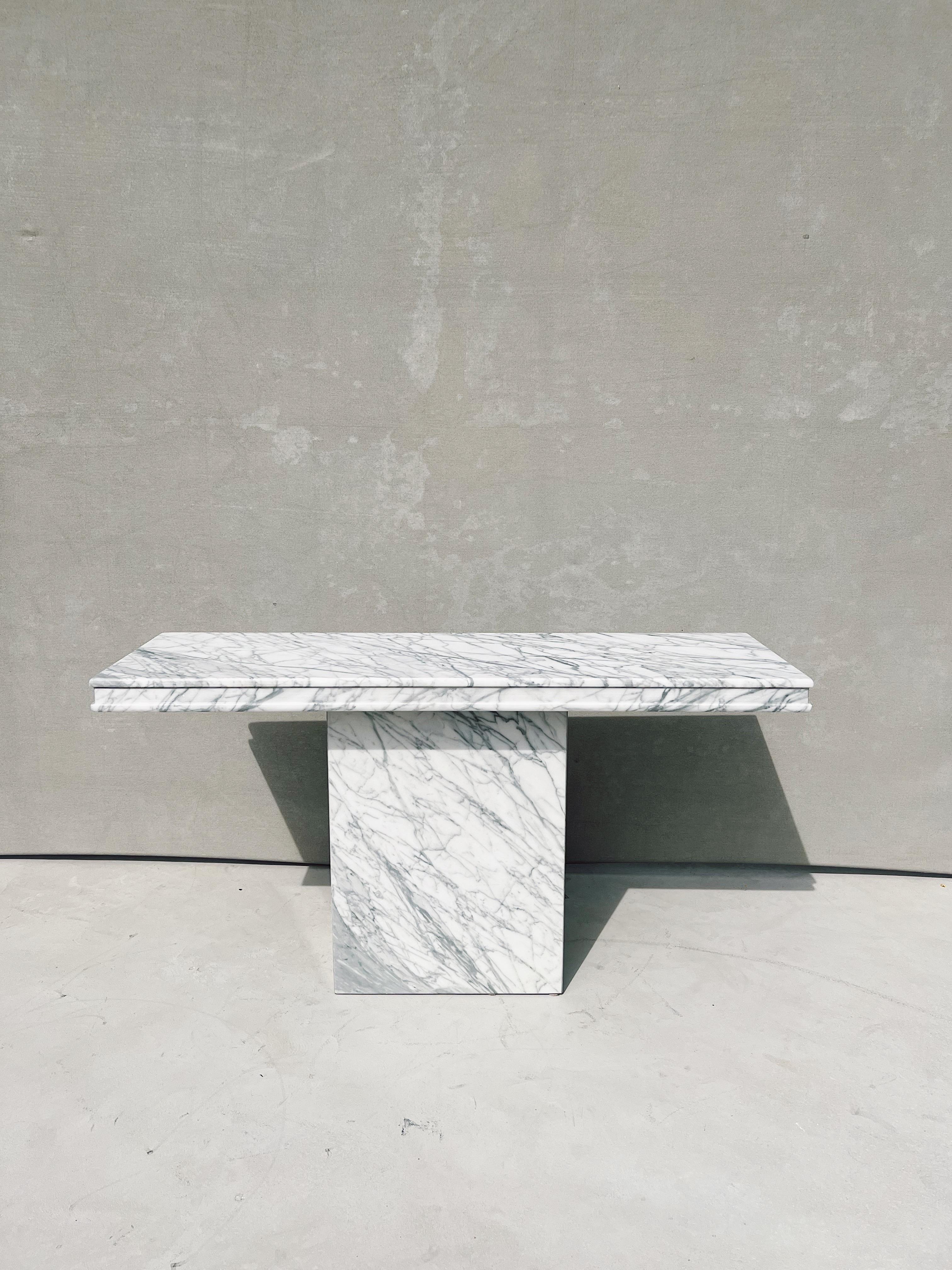 Vintage Italian Carrara marble rectangular console table

Carrara marble is one of the oldest marbles in the world. It is simple, sophisticated and elegant. It is sure to fit into whatever interior it is placed in. 

Designed and created in the