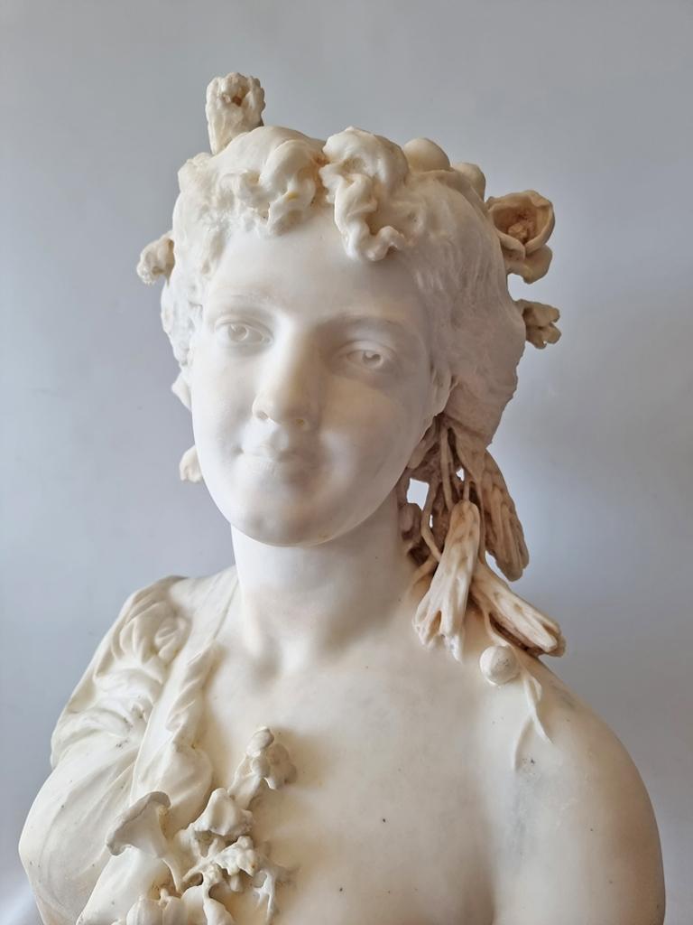 A very fine Italian Carrera marble sculpture of Flora. A beautiful young girl looking to dexter, she has her hair braided. Flora was the Roman goddess of the flowering of plants and flowers, the personification of the spring season. Superbly carved