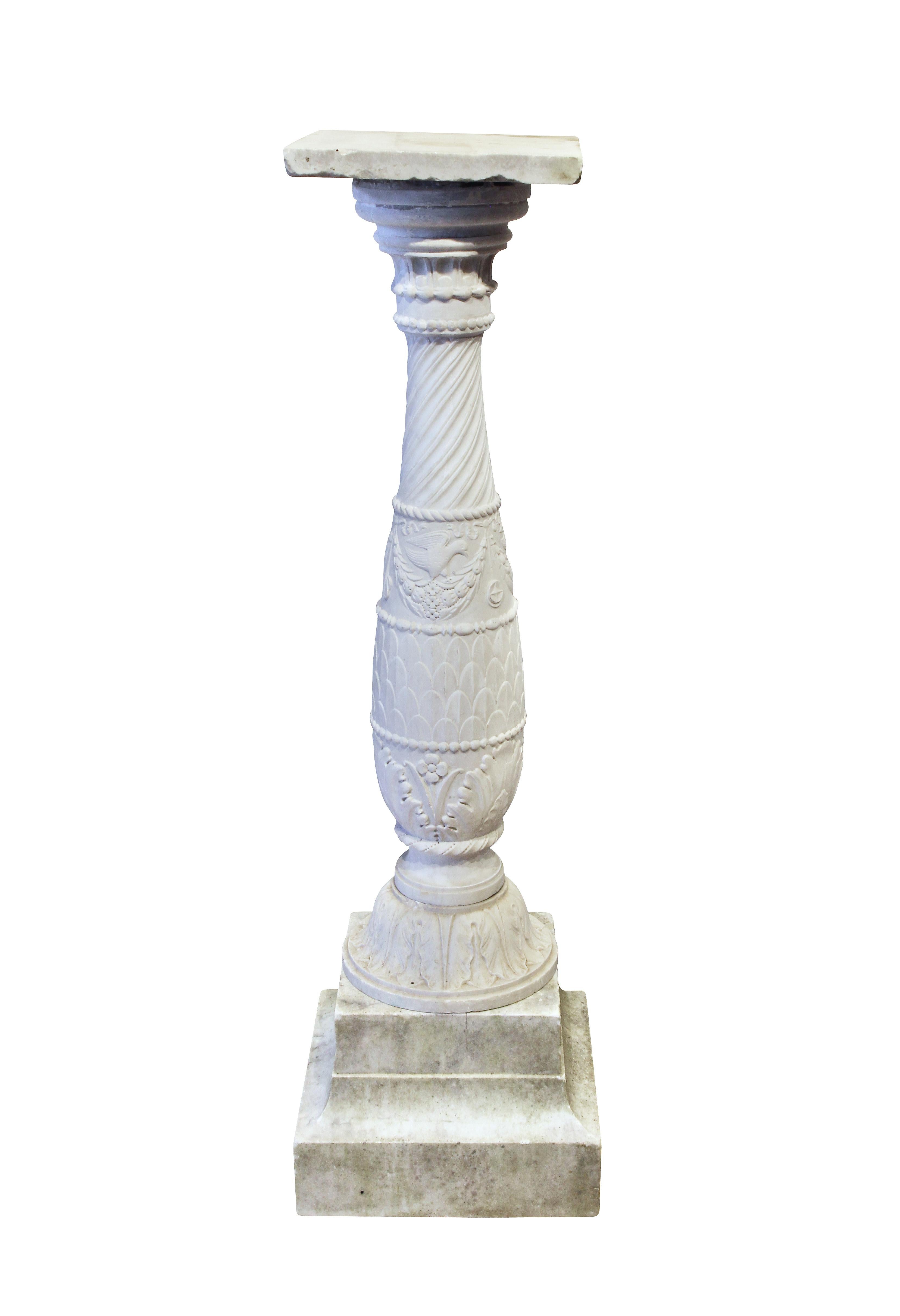 Well carved with associated square top, baluster form carved with leaves and birds, comes apart in three sections.