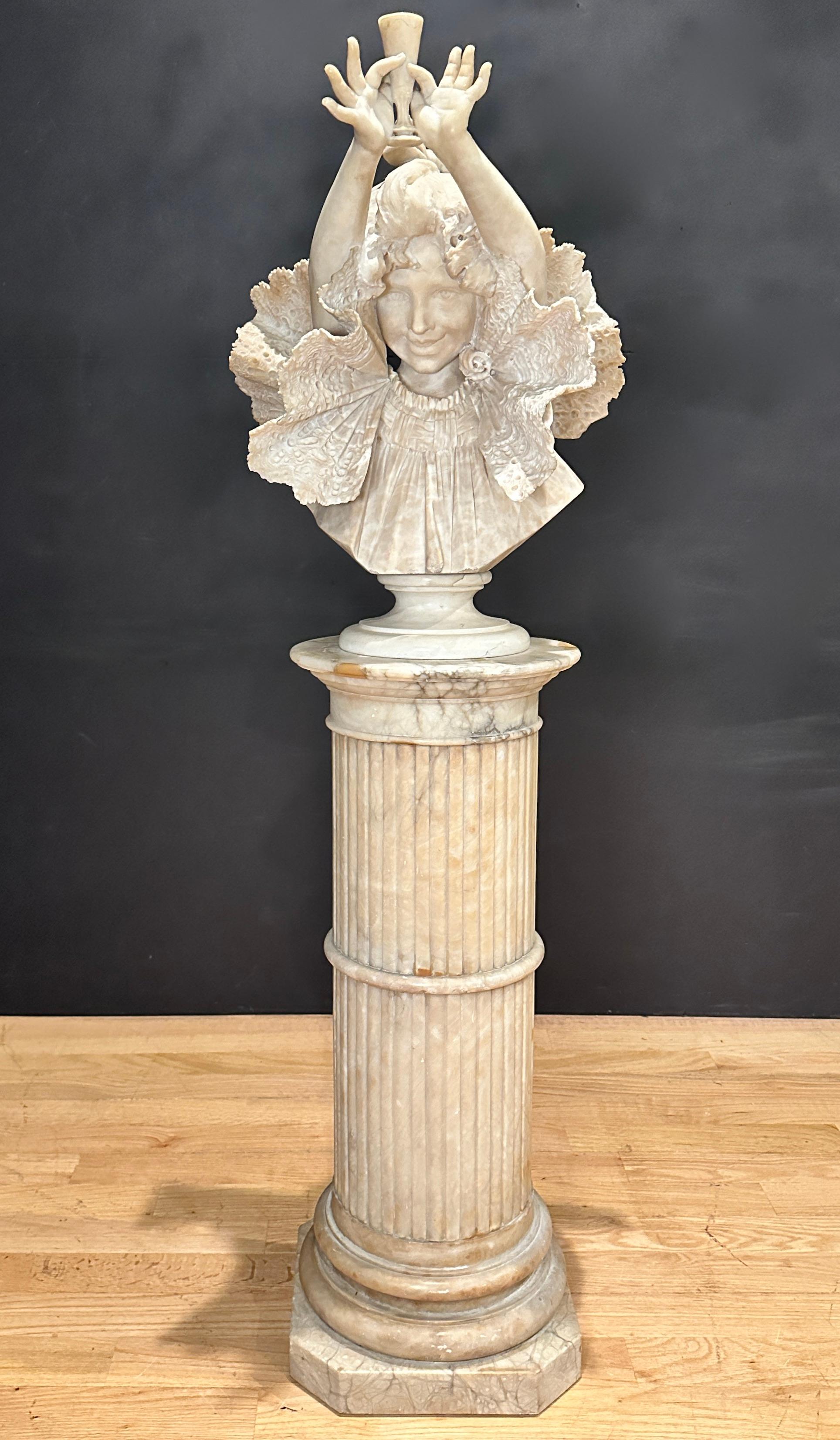 Masterfully carved and sculpted alabaster bust of a young girl with outstretched arms holding up a cup by Antonio Frilli. Smiling faced young girl, wearing lace and ruffled clothing, wonderfully carved, and open fingers holding up a cup. Signed