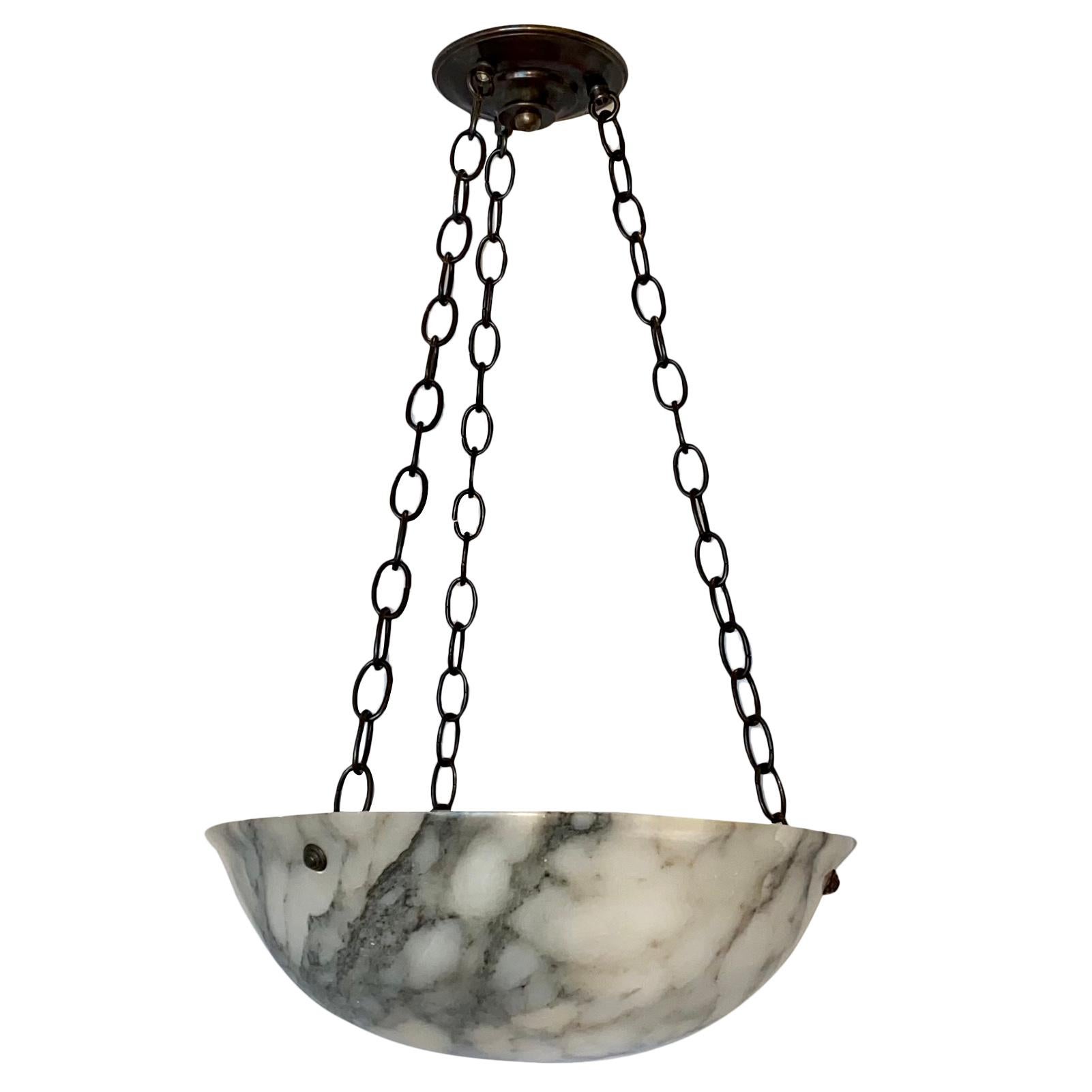 A circa 1920s Italian carved alabaster light fixture with three interior lights.

Measurements:
Current drop 26