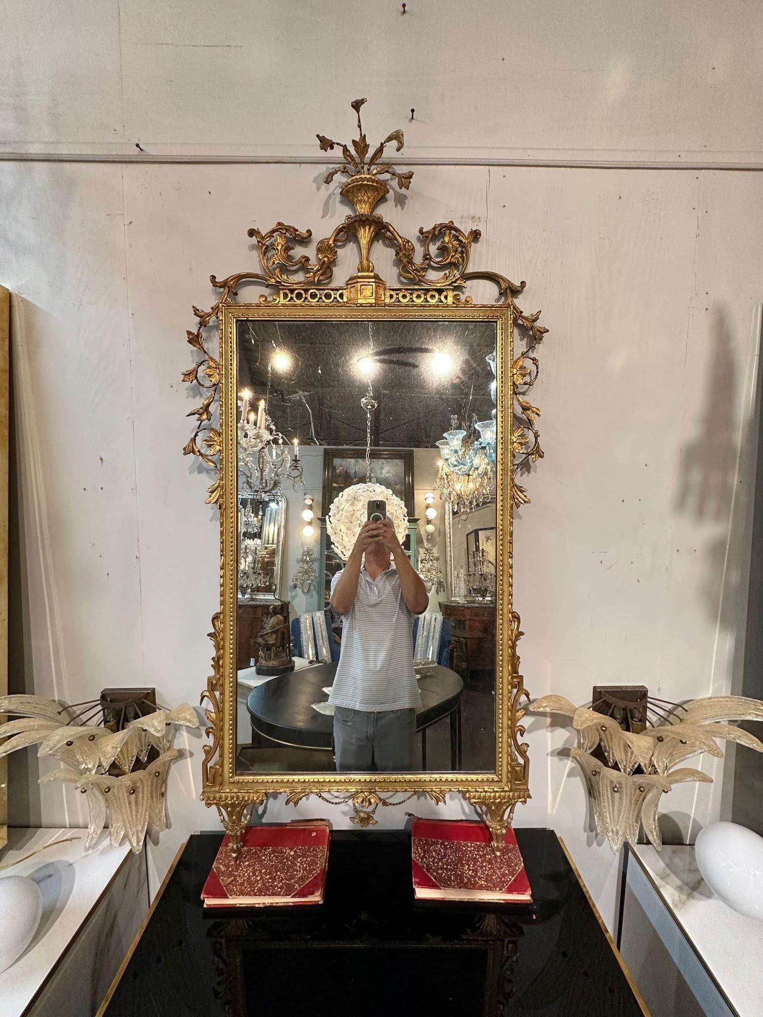19th Century Italian carved and giltwood Neo-classical mirror. Circa 1860. Sure to make a statement!