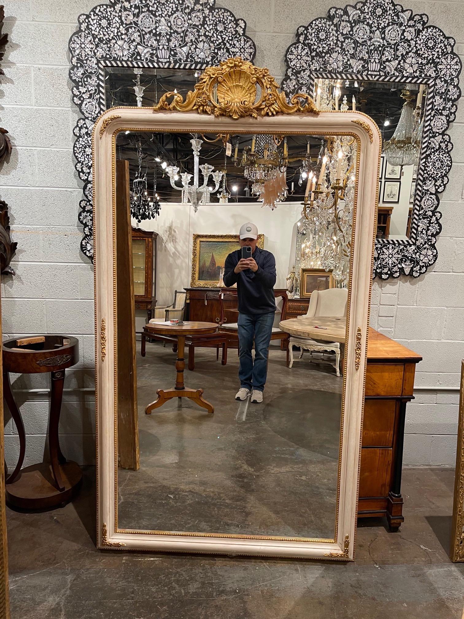 Exquisite Italian carved and painted classical Louis XV style mirrors. Pretty colors of creme and gold and
beautifully carved crown at the top. So elegant!! Note: Price listed is per item.