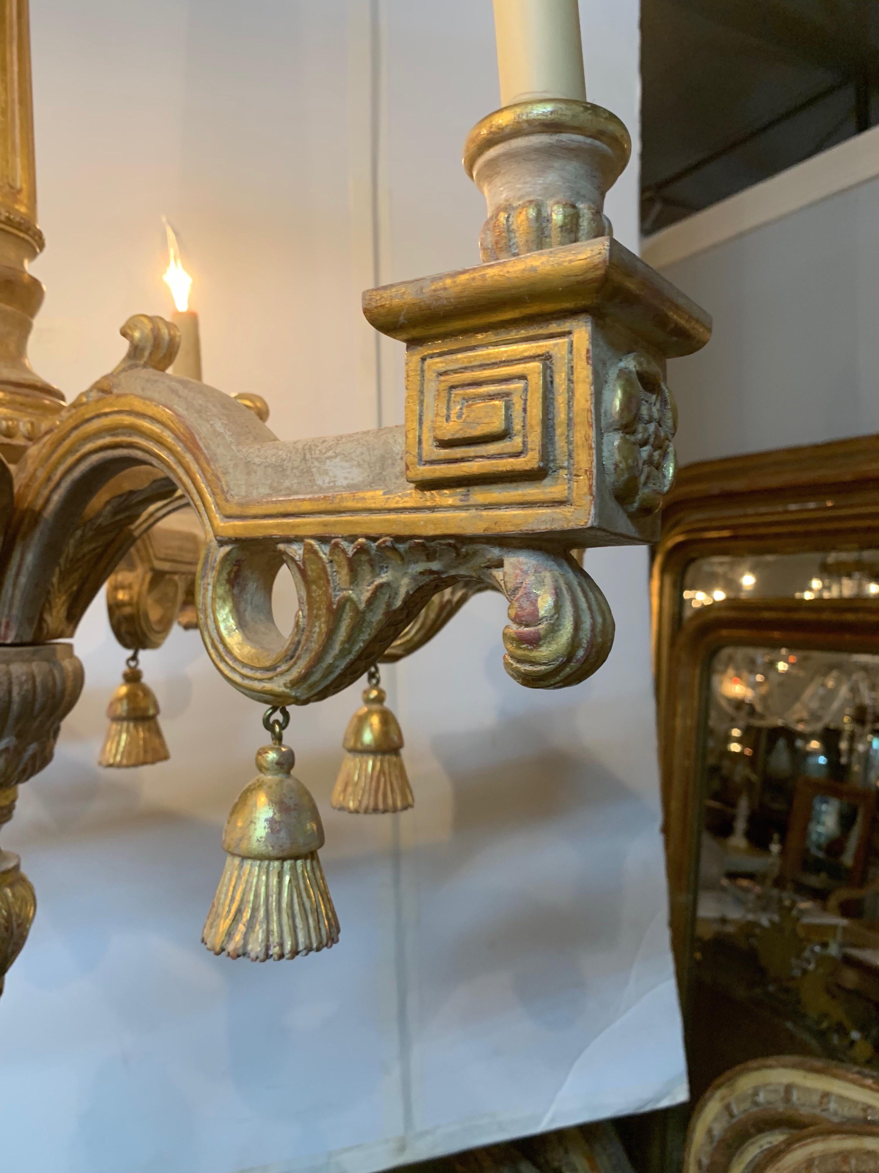 Beautiful Italian carved and parcel gilt chandelier with 6 lights. Very nice carving and gold gilt on this fixture. Truly elegant for a fine home.