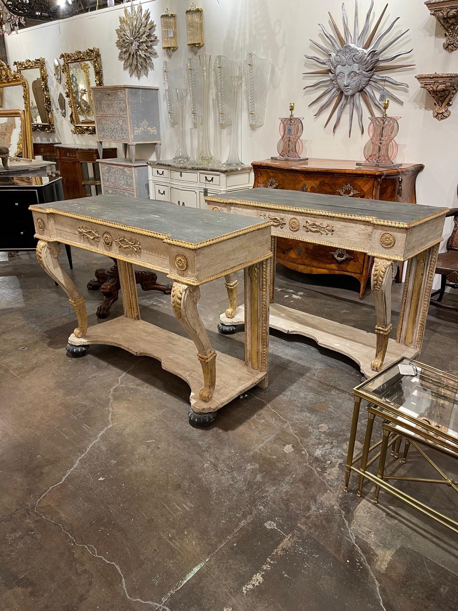 Beautiful Italian carved and parcel-gilt consoles. Nice patina in colors of creme, black and gold along with pretty carvings. Lovely!! Note: Price listed is per item.