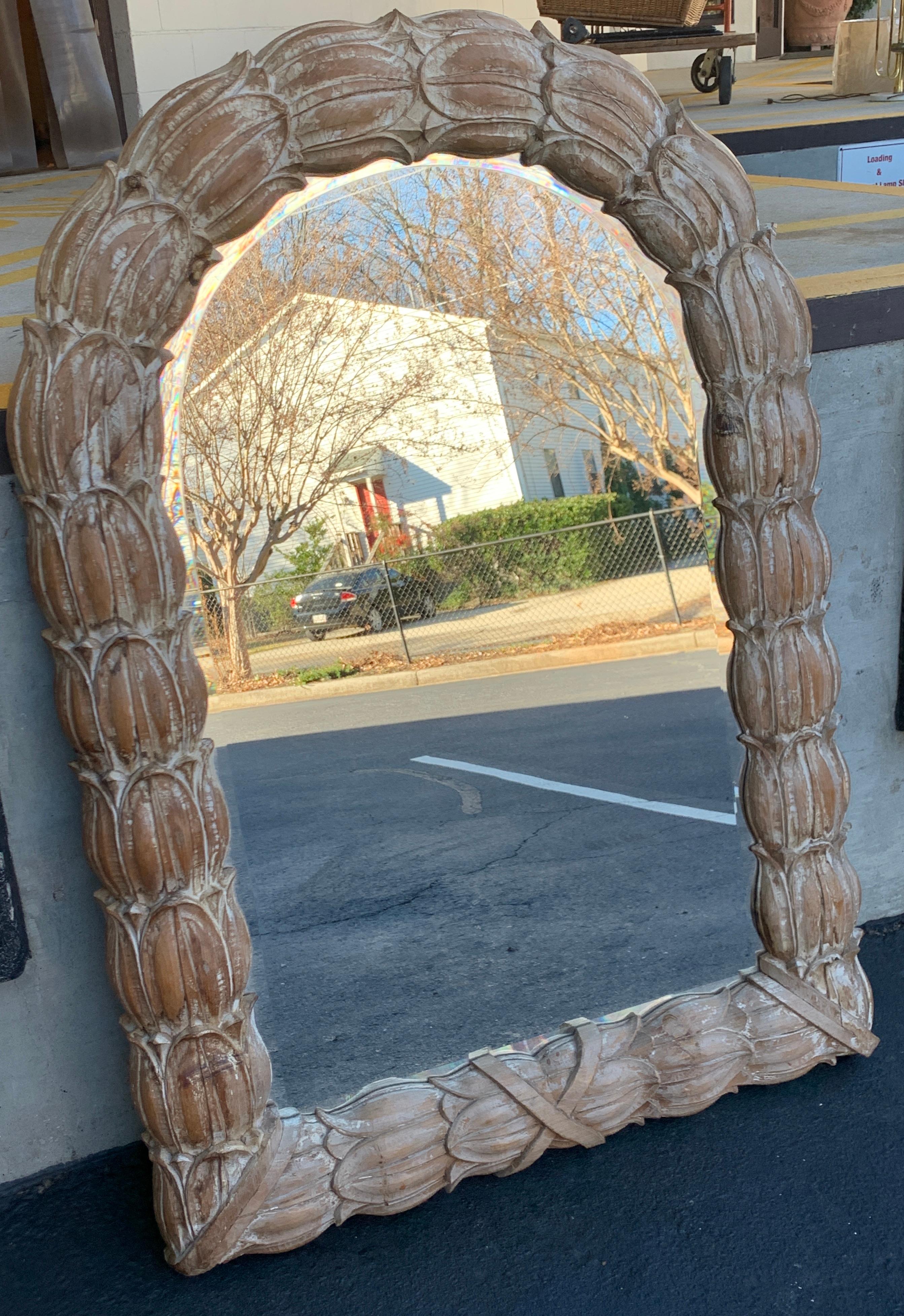 Italian carved and polychromed neoclassical mirror, with continuous well carved acanthus and ribbon surround. The beveled mirror itself measures has a 27