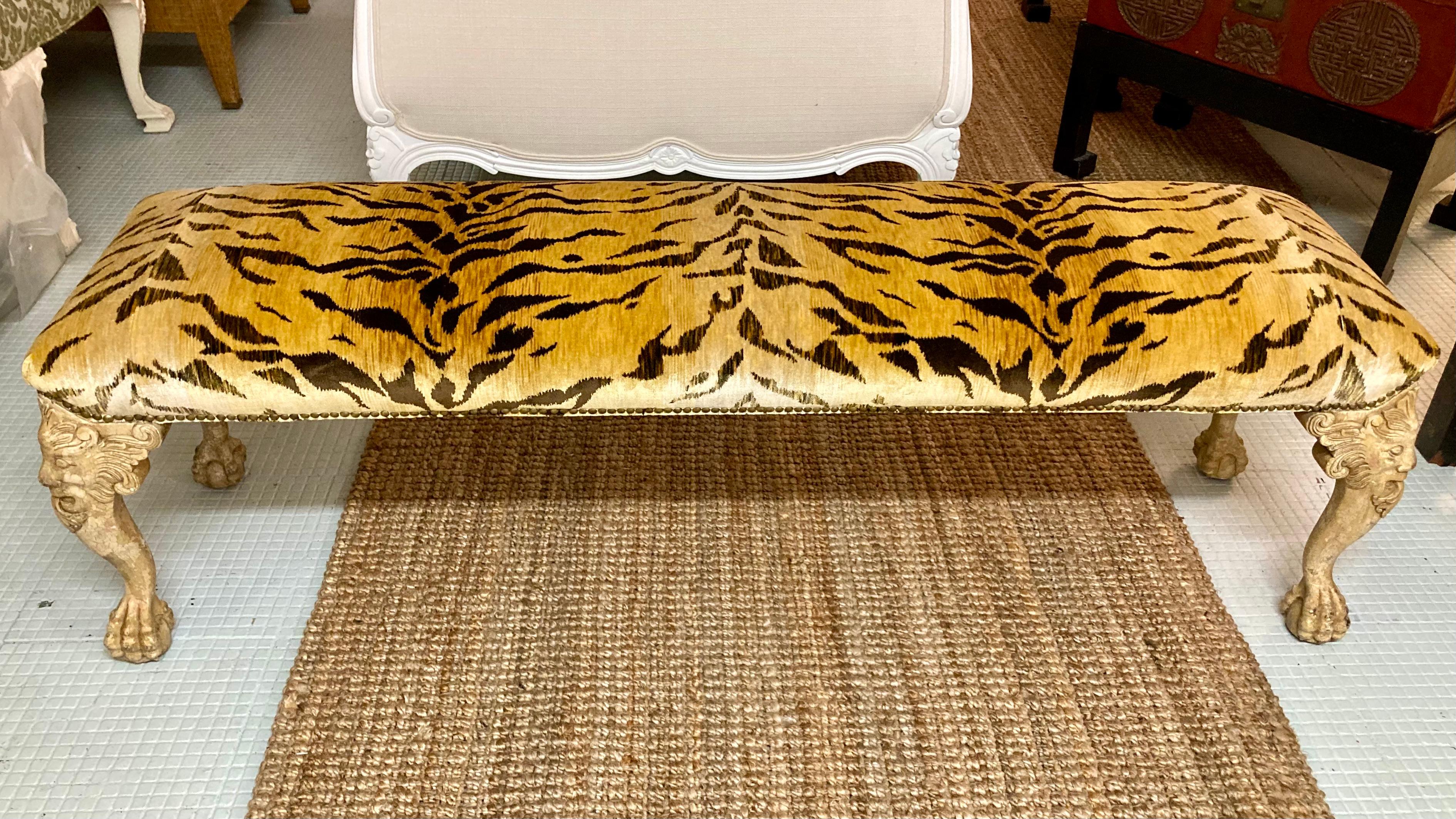 Beautiful Italian carved bench freshly upholstered in tiger silk velvet. Very nice nail head details around the perimeter. Each leg has a hand carved grotto head and the original finish. Add some eclectic Venetian style to your home. Perfect at the