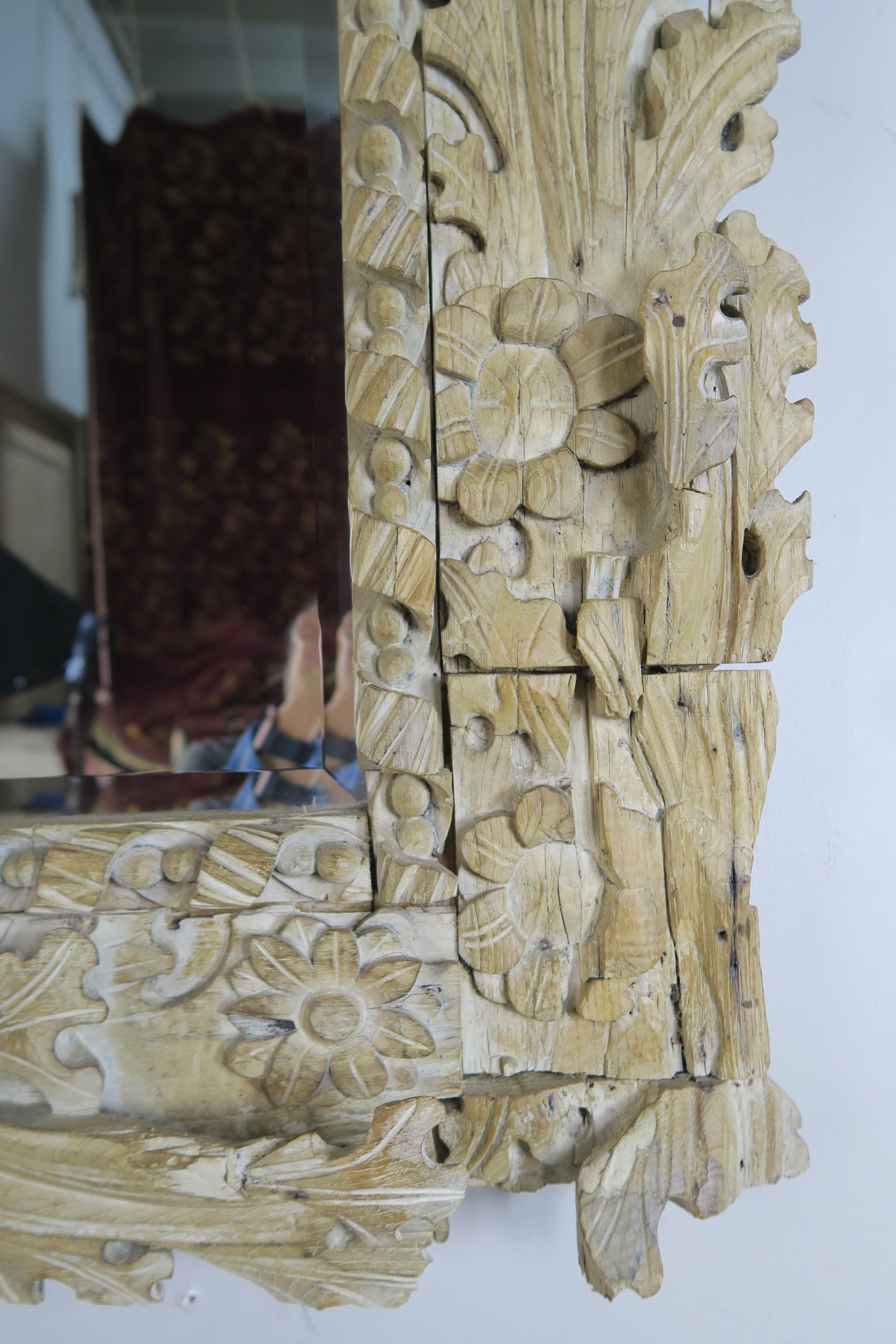 Italian carved bleached walnut acanthus leaf mirror with carved shell at top center. This mirror is comprised of antique carved wood elements.