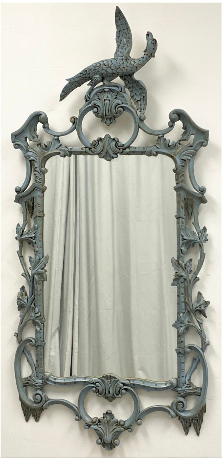 This is an Italian hand painted Chinese Chippendale style carved mirror. It is a mid- century piece and is unmarked but attributed to Friedman Brothers. 