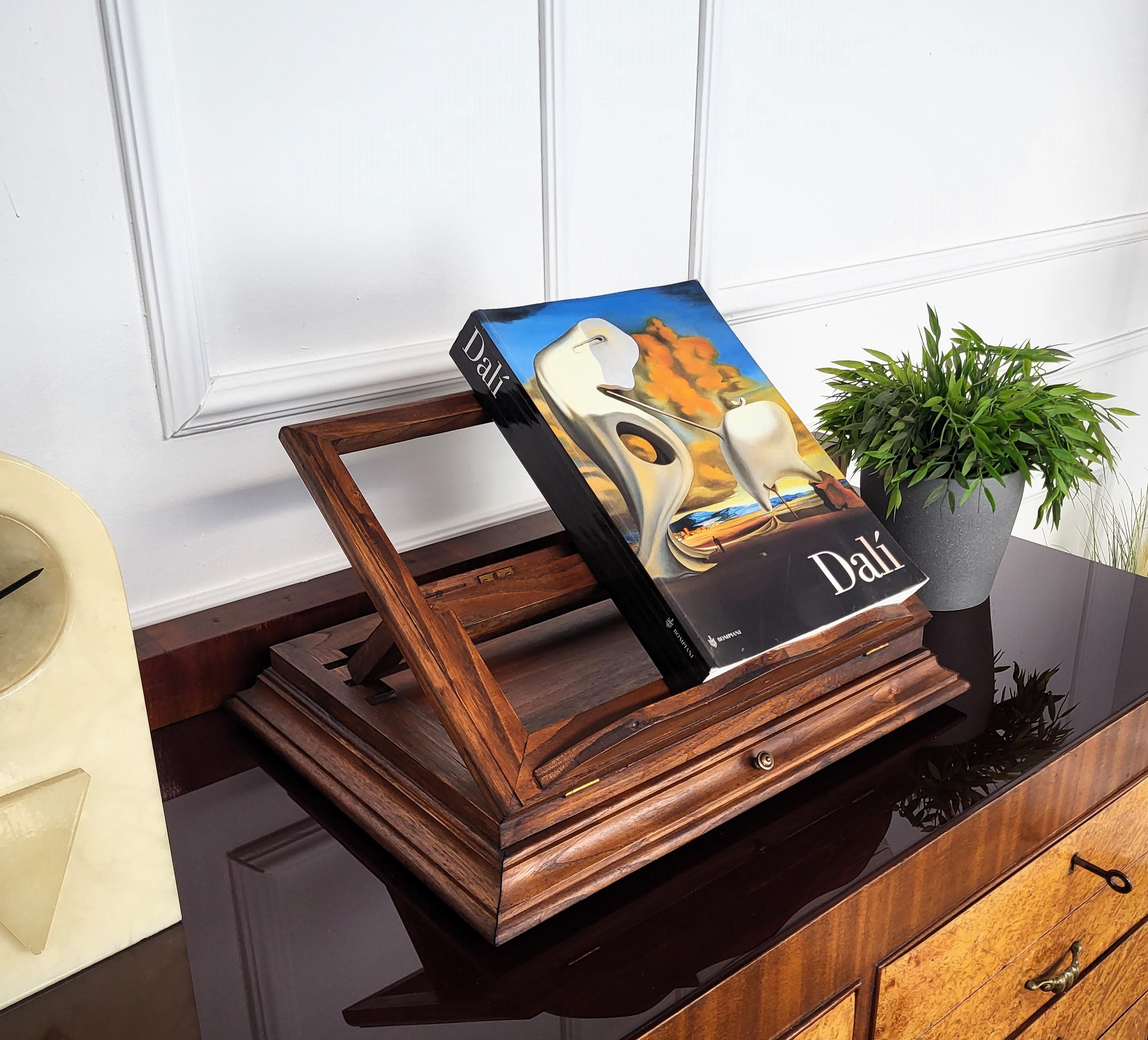If you are looking for the perfect way to display a book or photo or otherwise then this unique and decorative bookstand could be ideal, beautifully crafted and detailed in the frames, central drawer with handle and with its warm patina. It can look