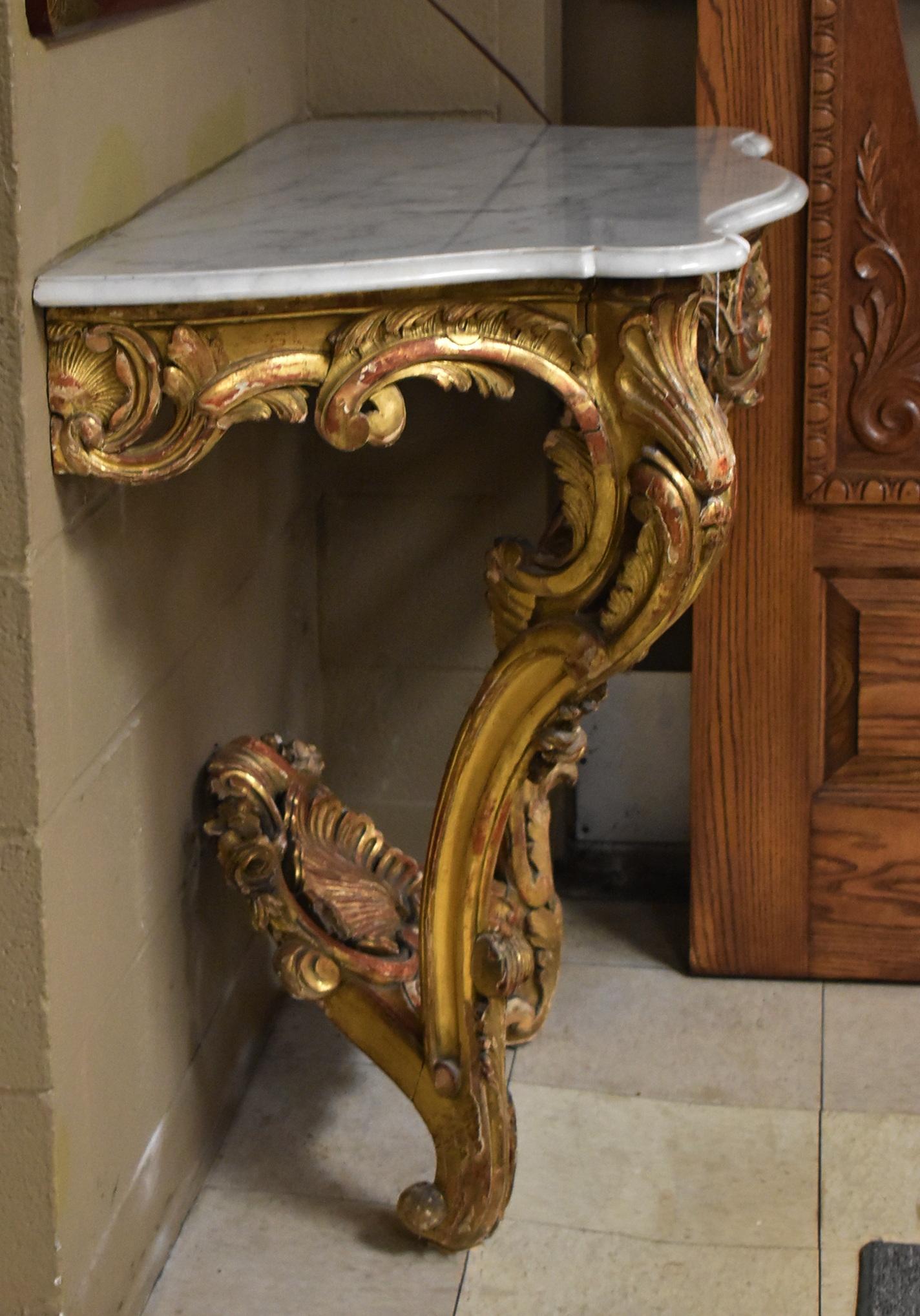 Italian carved gilt & red painted wood wall mount marble-top table with center shell detail.