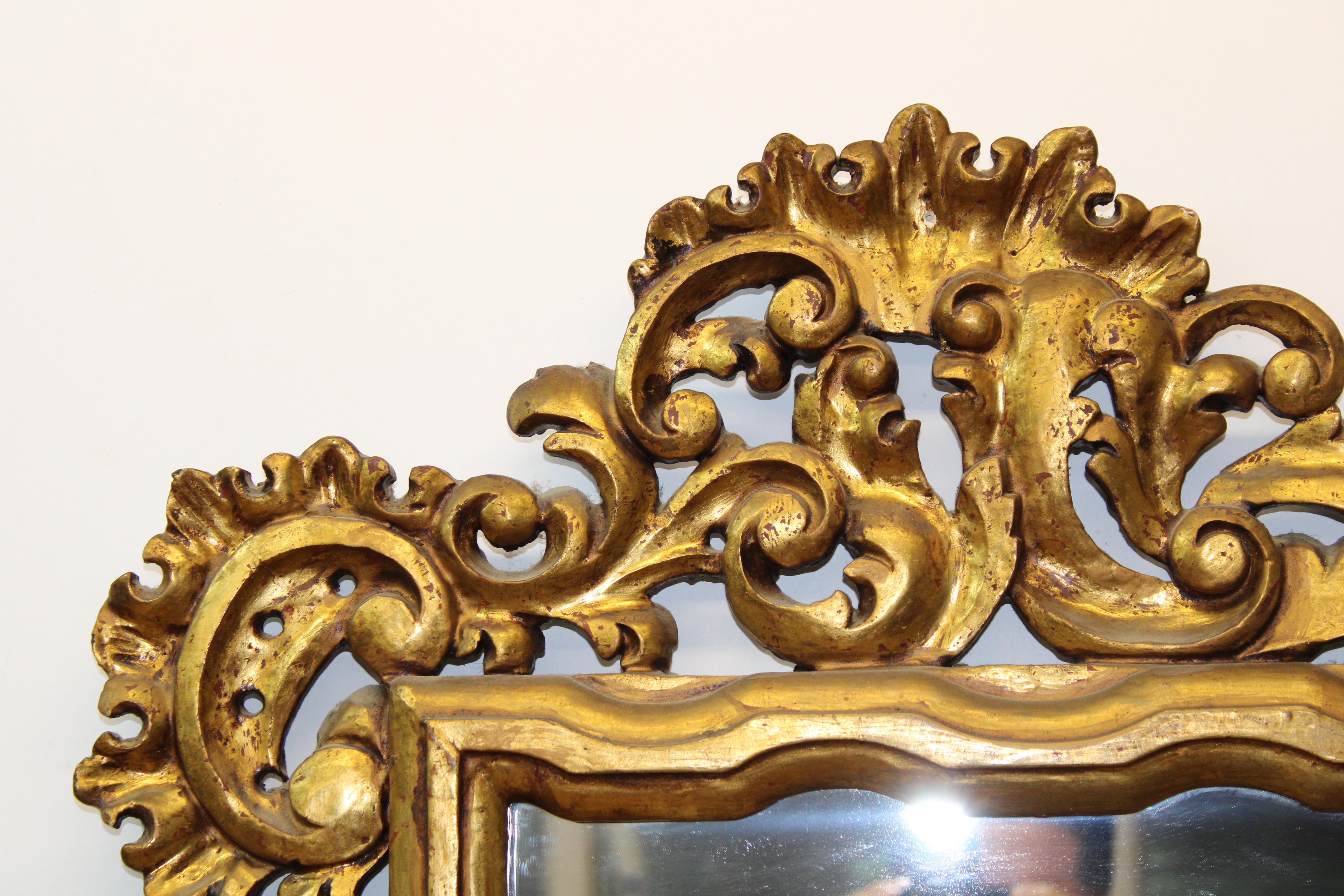 C. 20th century

Italian carved giltwood mirror.