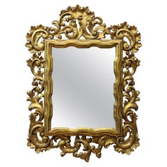 Specchio italiano intagliato in legno dorato