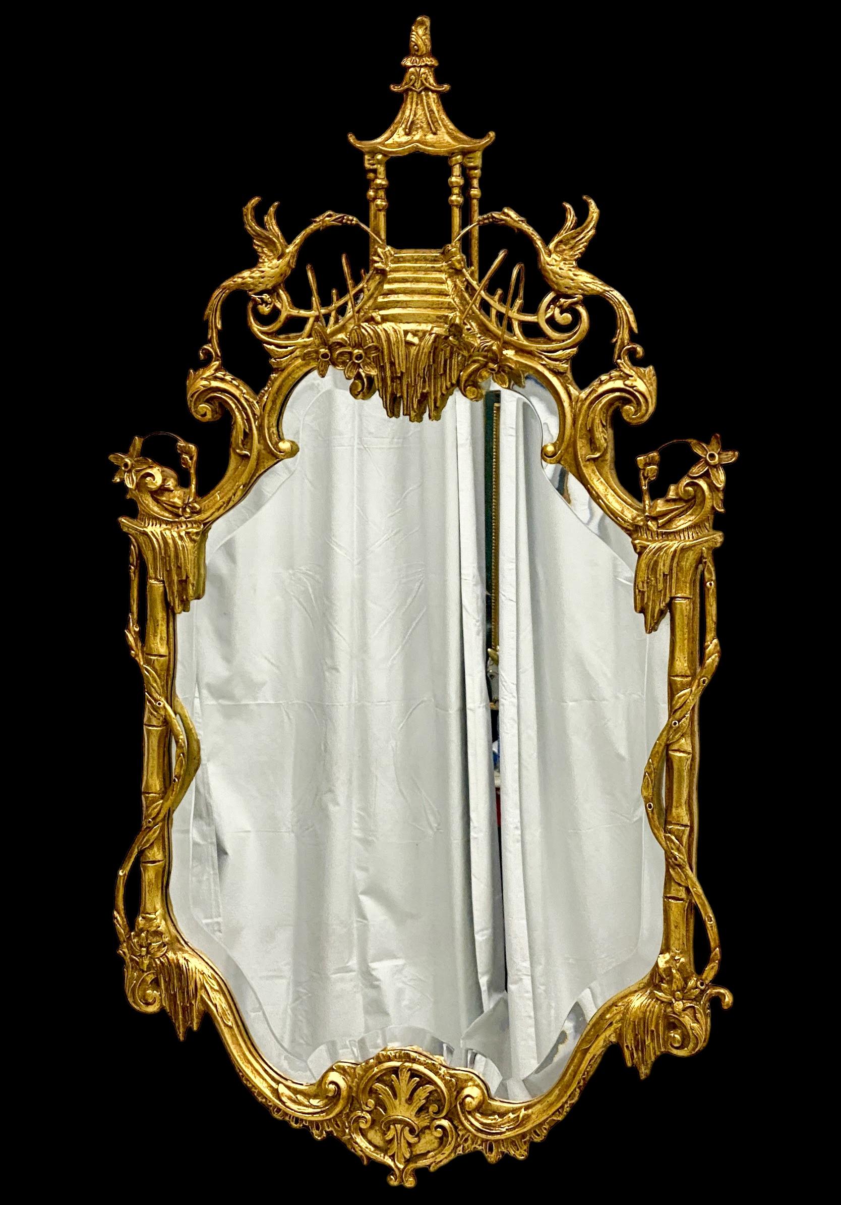 This is a mid-century Chinese chippendale style carved giltwood Italian mirror attributed to the renowned mirror manufacturer, Friedman Brothers. It is Italian and in very good condition.
