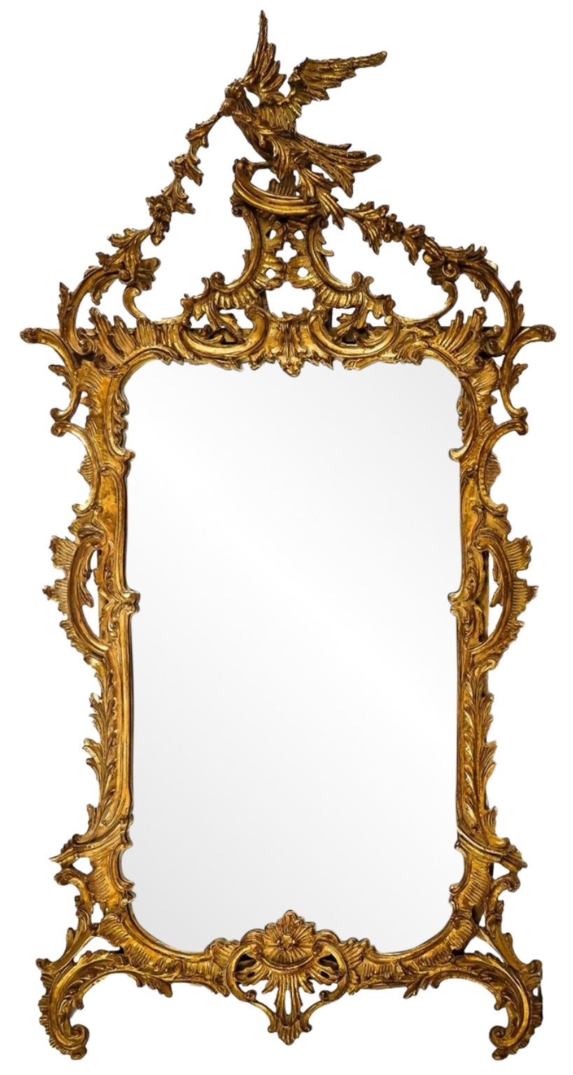 This is an Italian Chinese chippendale style carved giltwood mirror by Carver’s Guild. It is a really nice scale, and note the Ho Ho bird with the draping garland. It is marked and in very good condition.

Shipping is running two to five weeks.