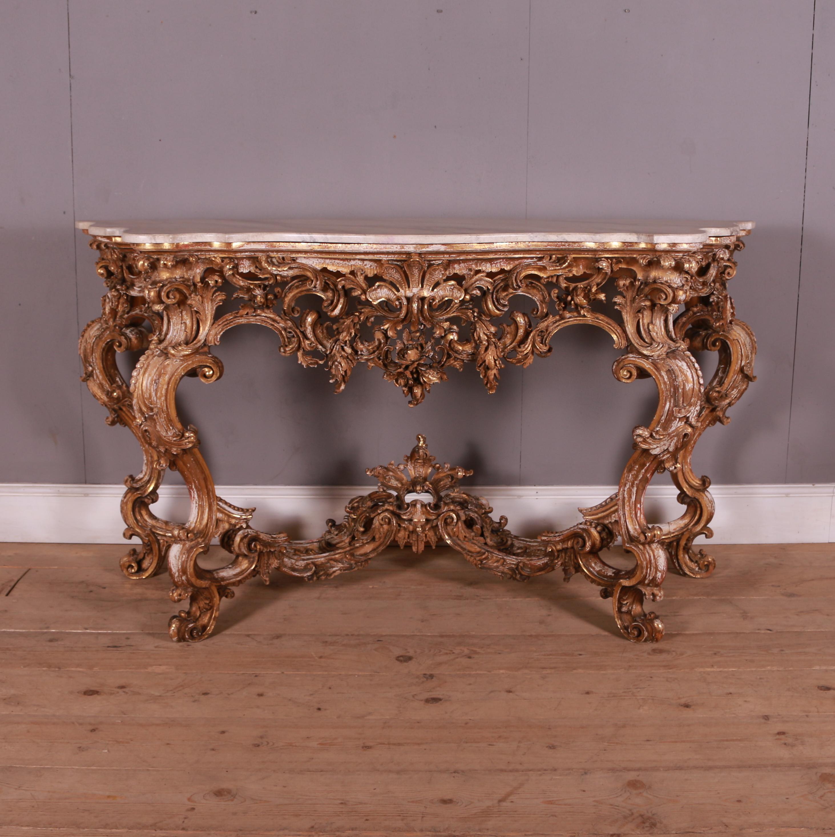 Early 20th C Italian carved giltwood console table with faux marble top. 1920.

Dimensions
68.5 inches (174 cms) wide
24 inches (61 cms) deep
37 inches (94 cms) high.

  