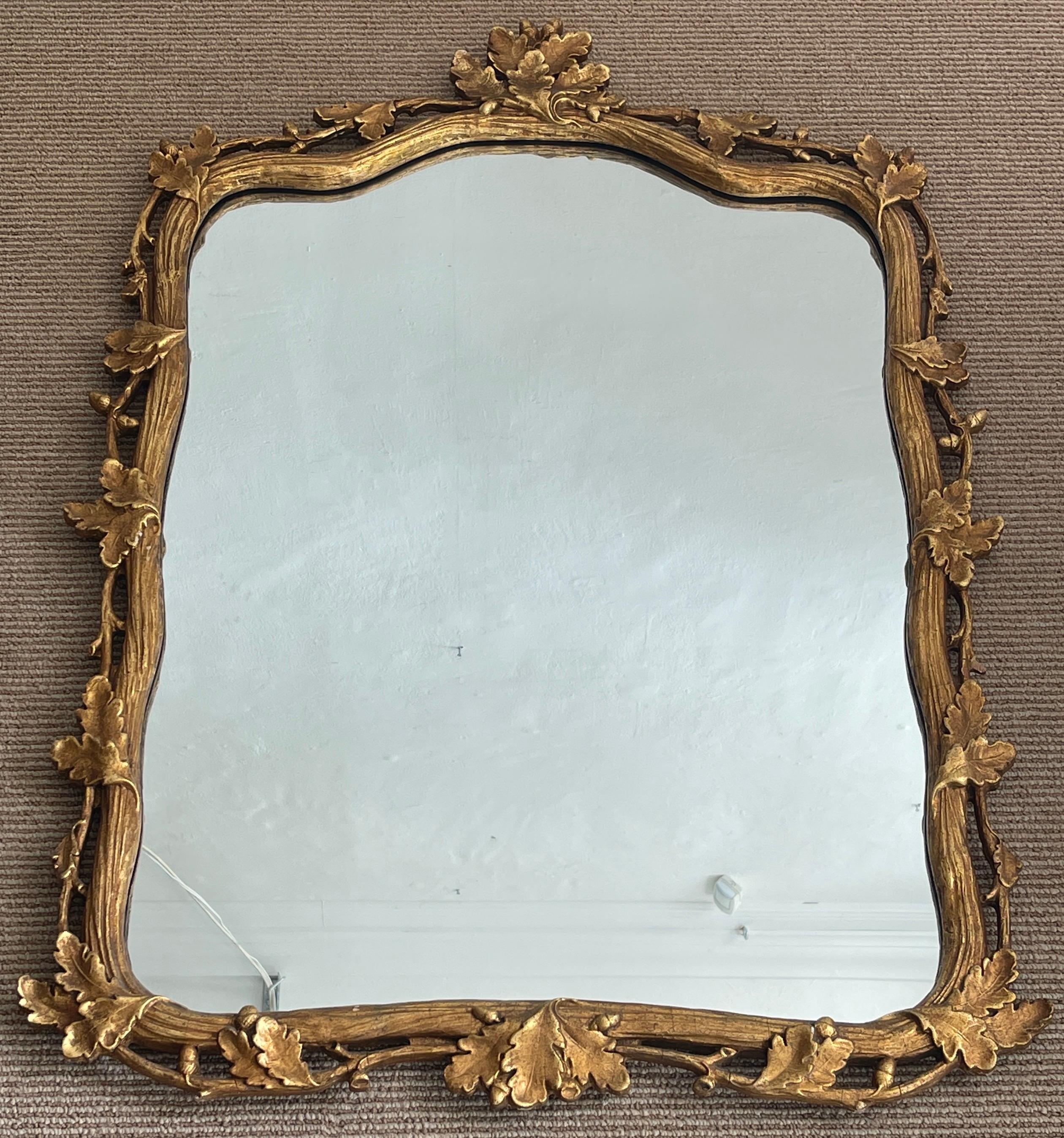 Italian carved giltwood faux bois & oak motif mirror, Nicely carve and gilt with pierced surround. The inset mirror measures 24