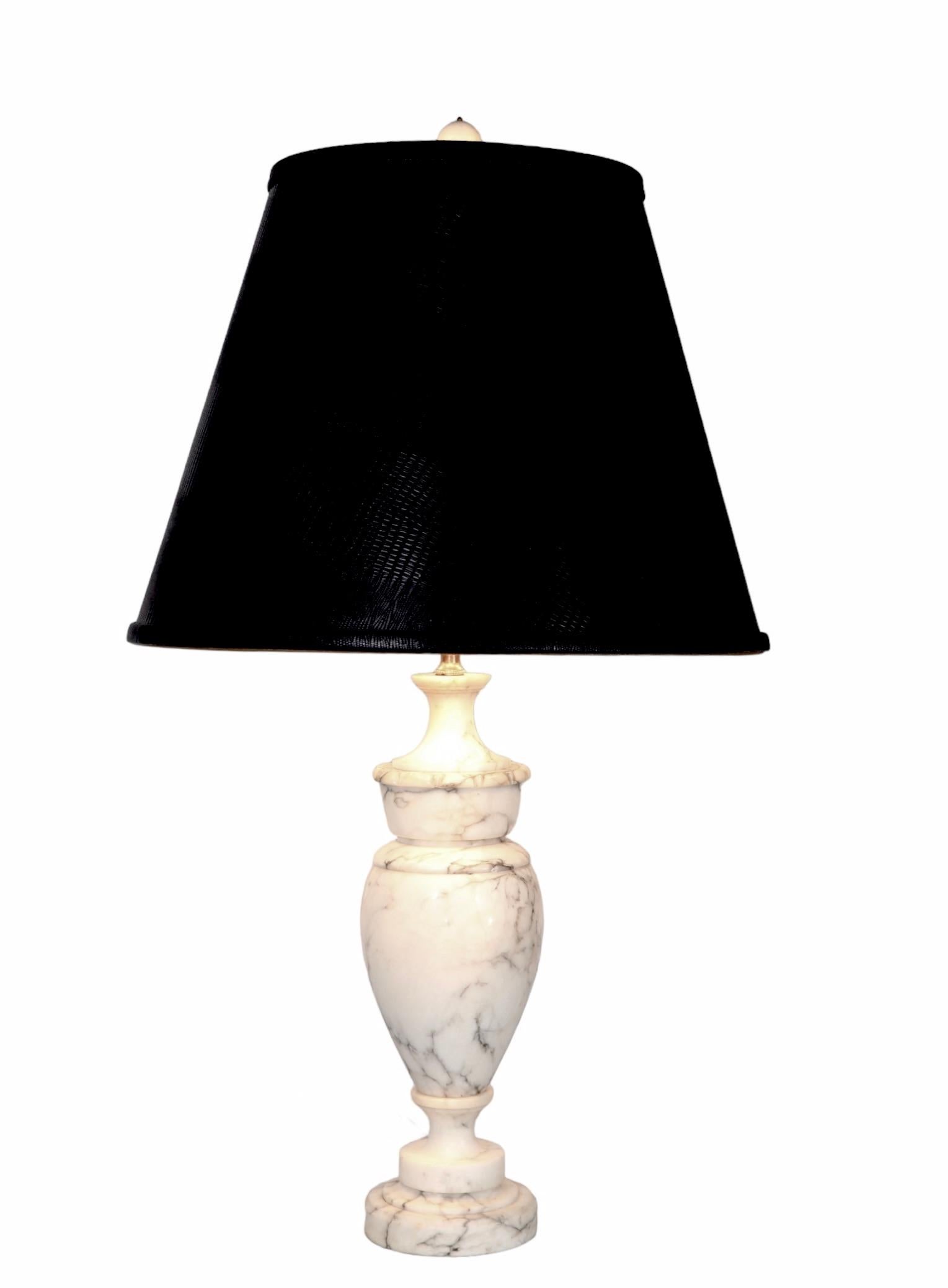 Chic Neo Classical, Hollywood Regency Italian carved marble, or possibly alabaster, table lamp, in very good, original clean and working condition. Sophisticated restrained design, perfect for classical, traditional and modern interior spaces. 
