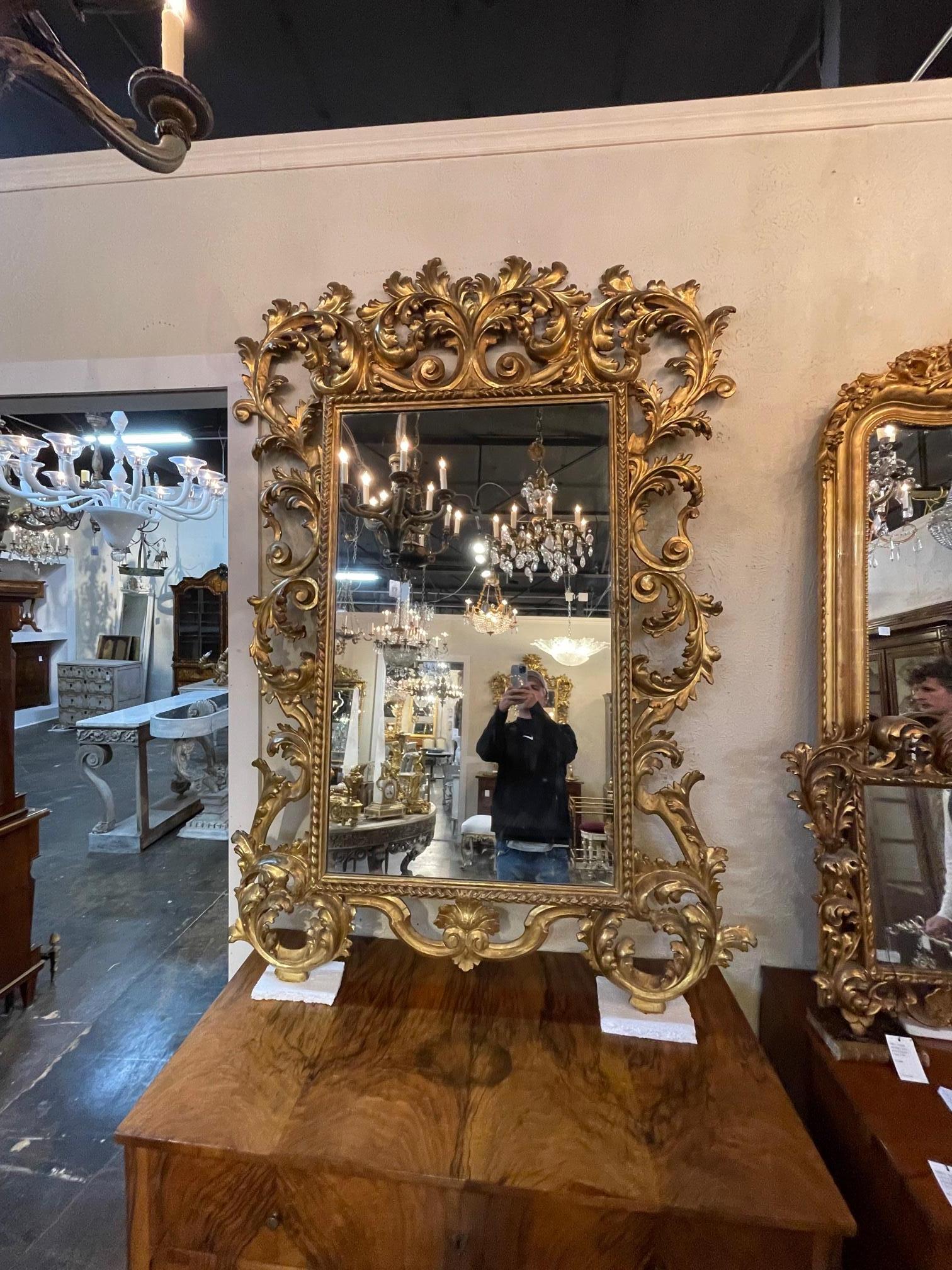 19th century Italian carved and giltwood mirror, circa 1850. This mirror is nicely carved with a beautiful gold finish. Sure to make a statement.
