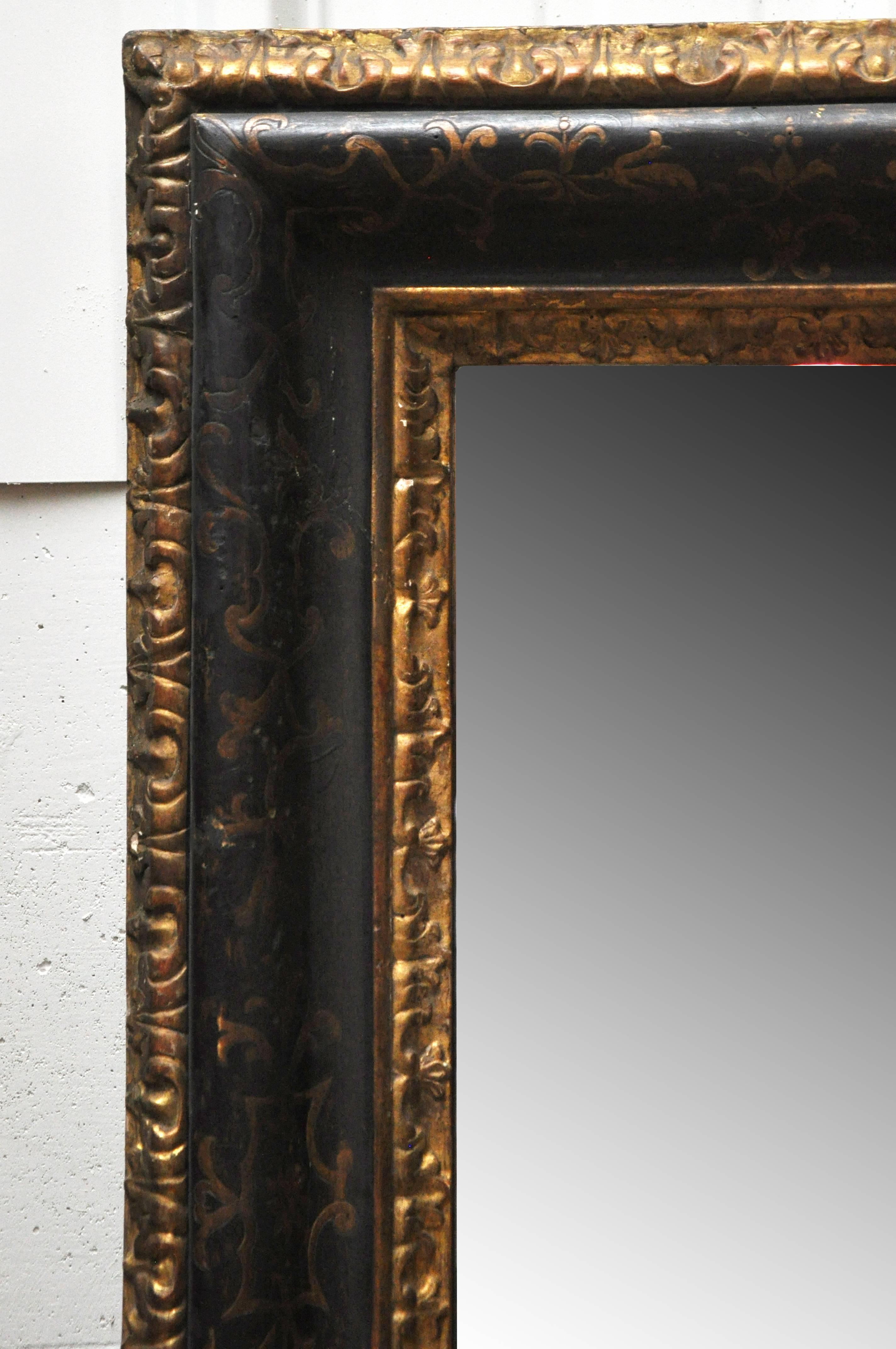 Beautiful black and gilt Italian mirror.
