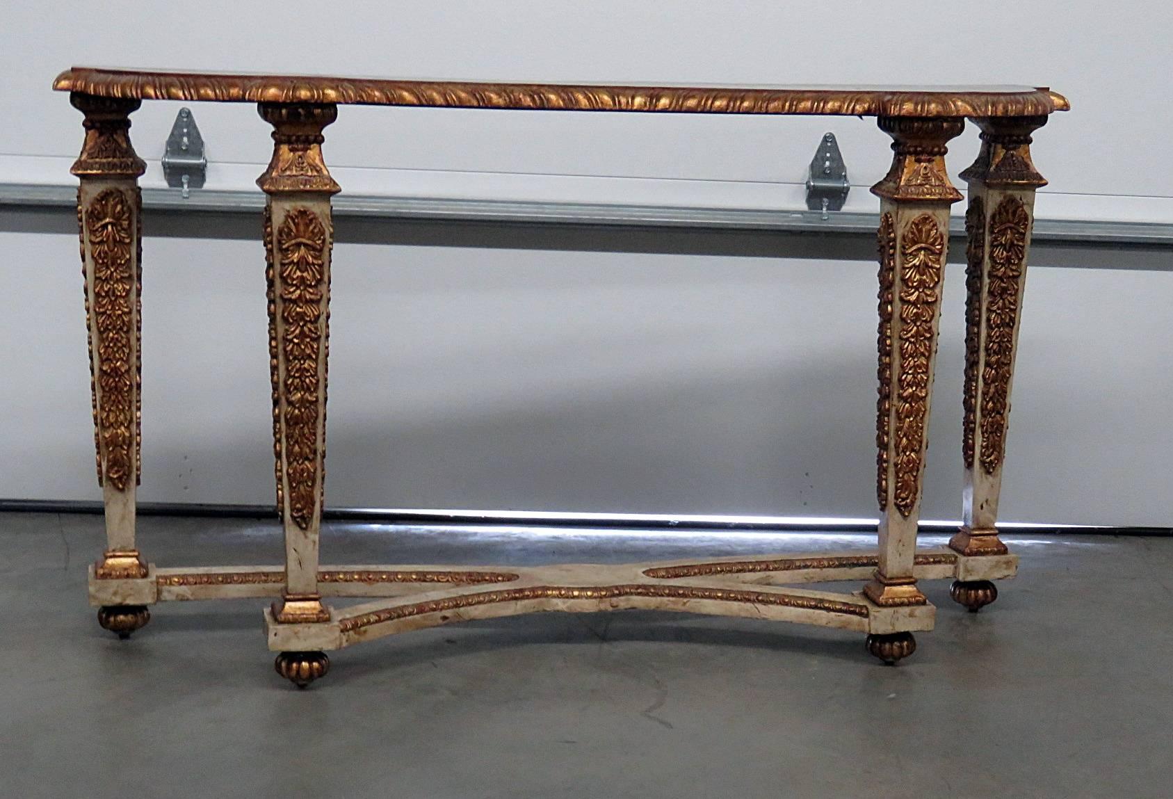 Italian carved oyster wood console table with a distressed finish and gilt decor.