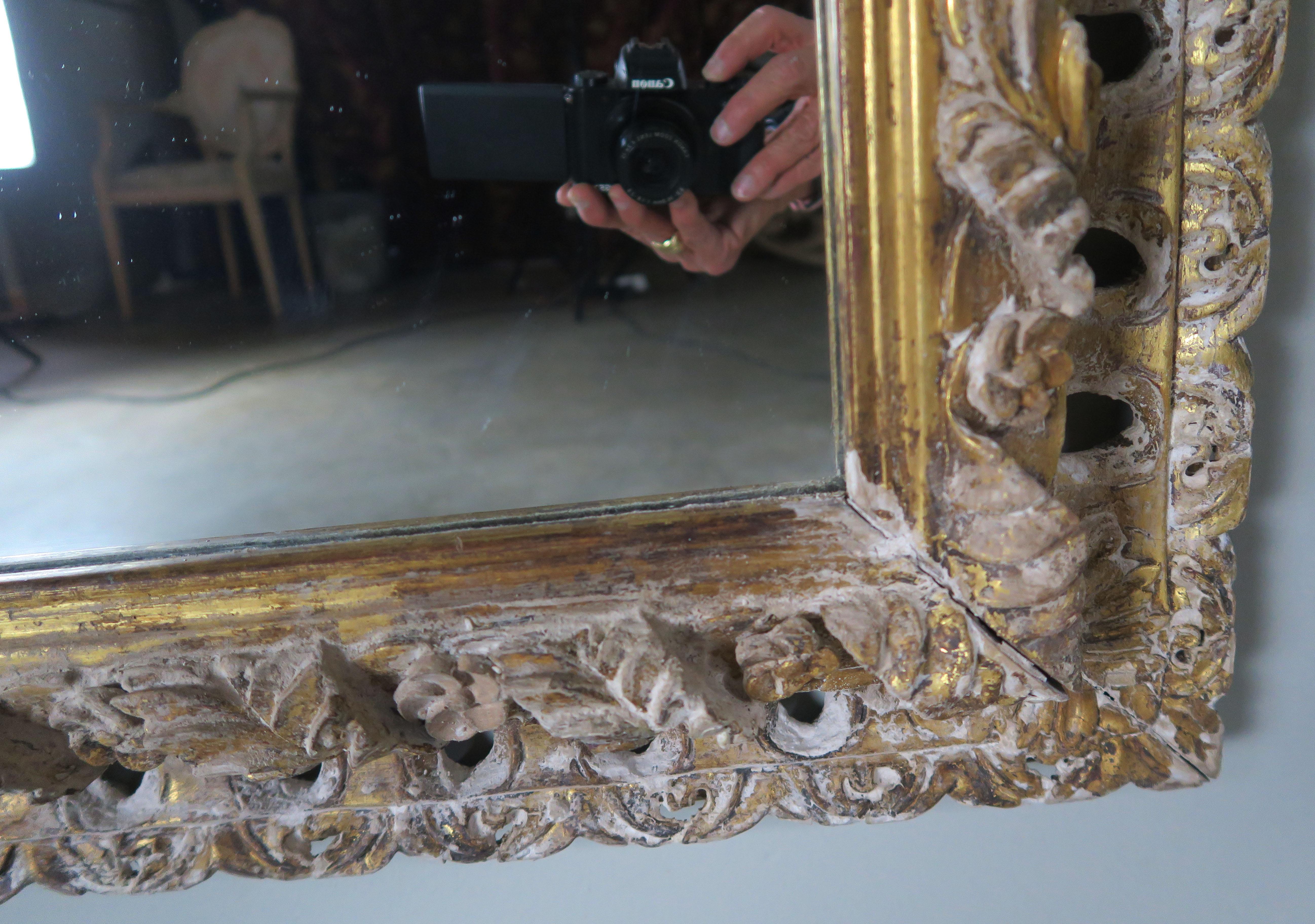 Italian Carved Painted Mirror with Gold Leaf Accents In Distressed Condition In Los Angeles, CA